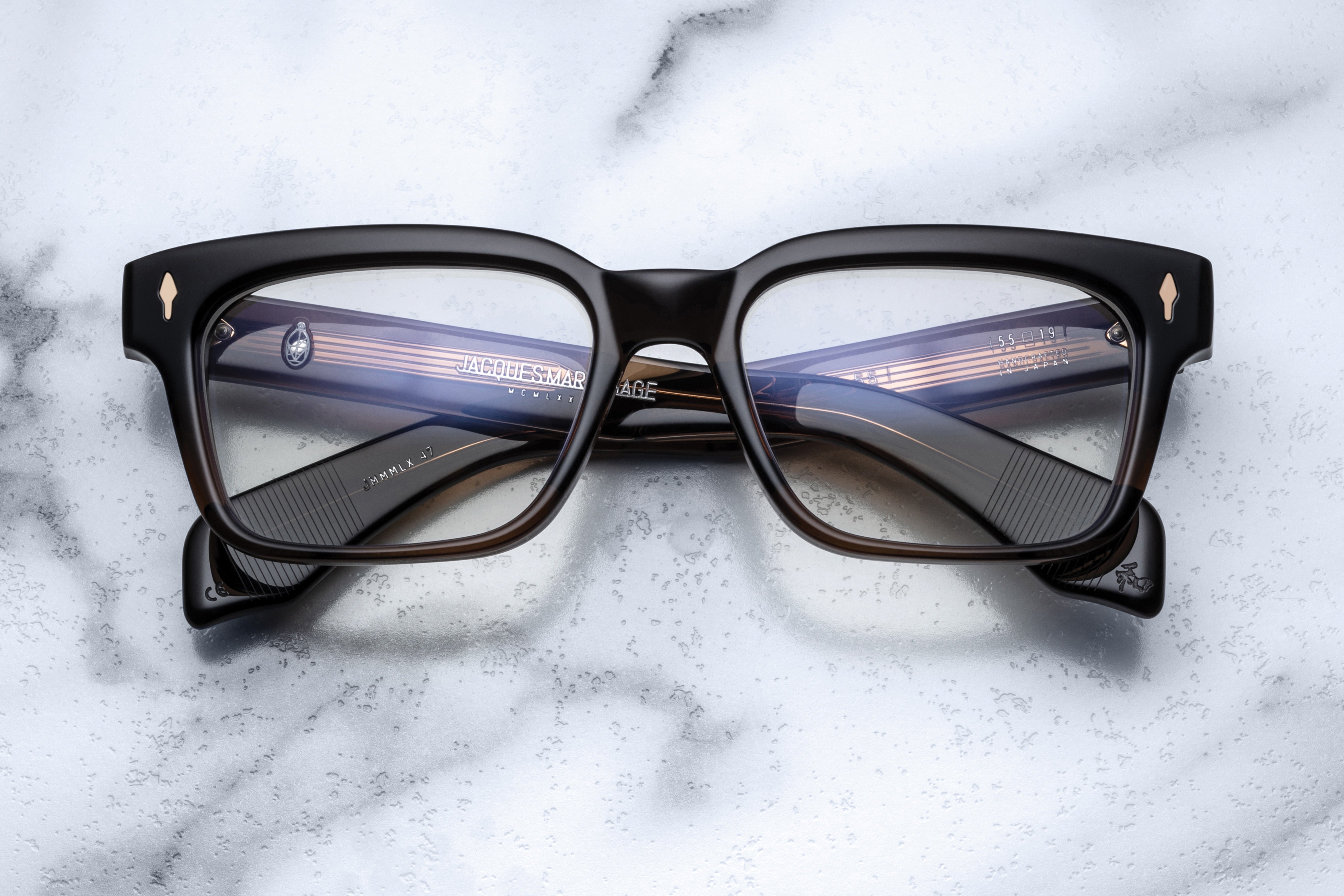 Jacques Marie Mage Molino 55 optical glasses with clear frames and sleek design, shown on a white background.