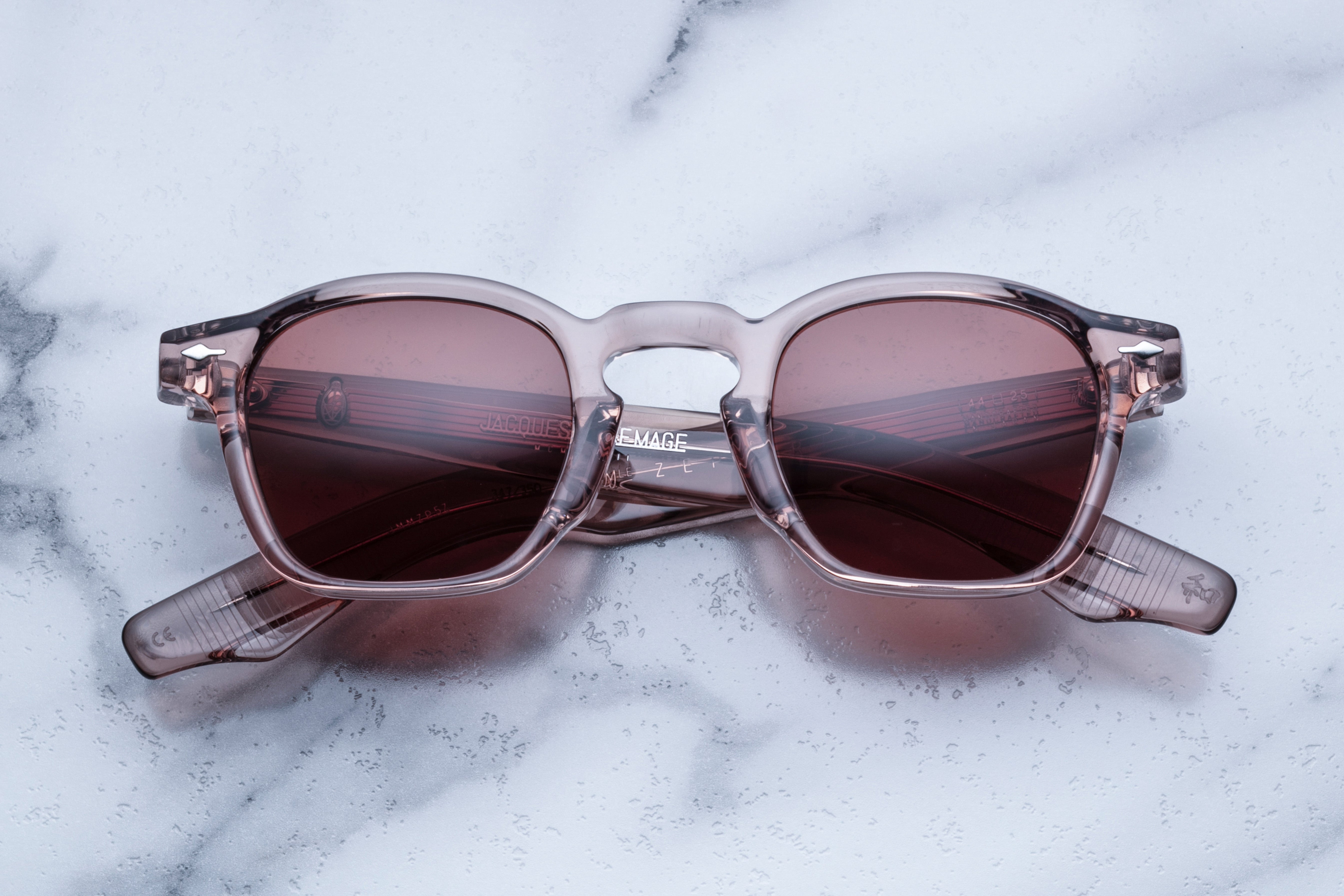 Jacques Marie Mage Zephirin sunglasses with heather-colored frames and clear lenses, front view showcasing stylish eyewear design.