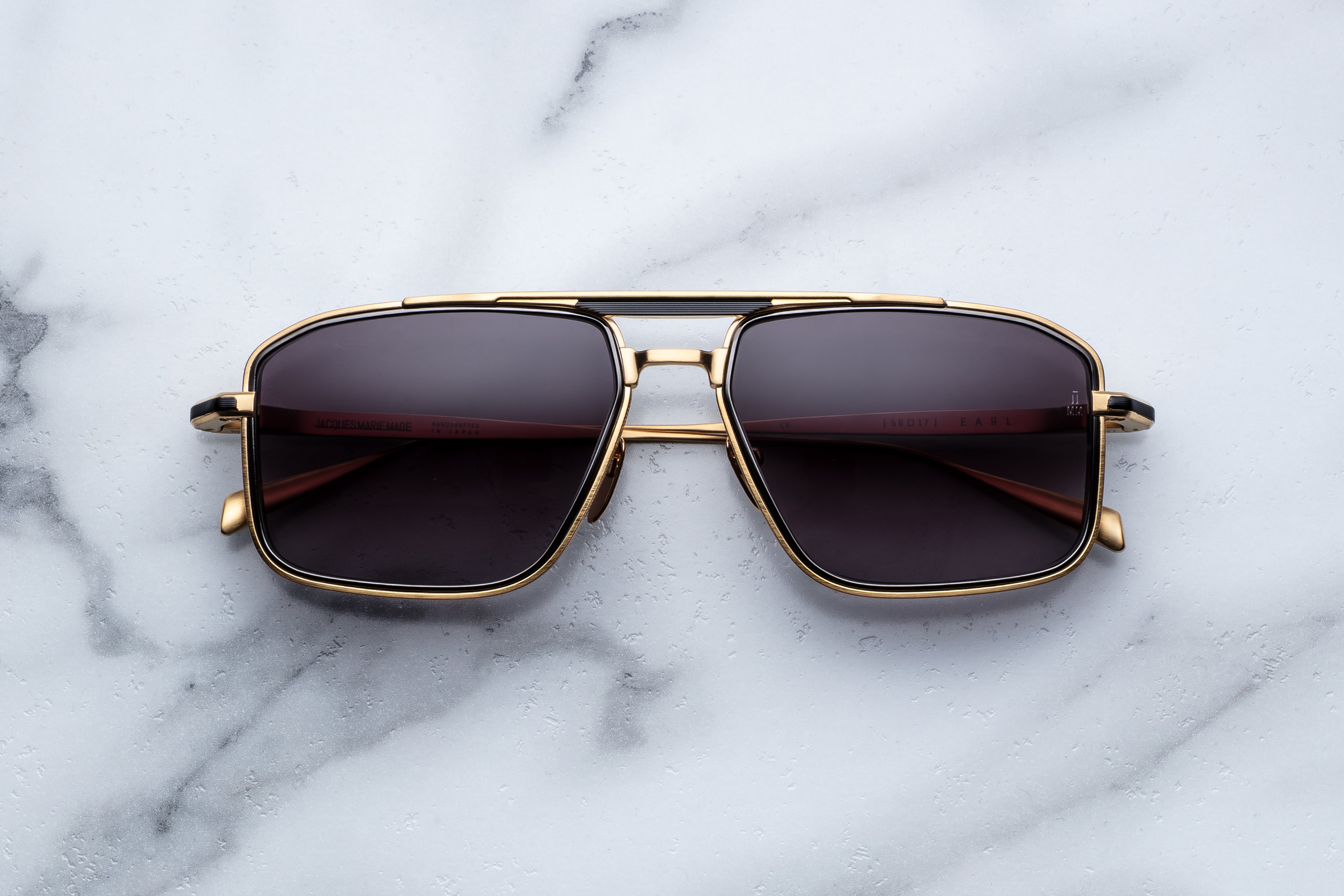 Jacques Marie Mage Earl sunglasses with round frames and metal accents, shown from the front on a white background.