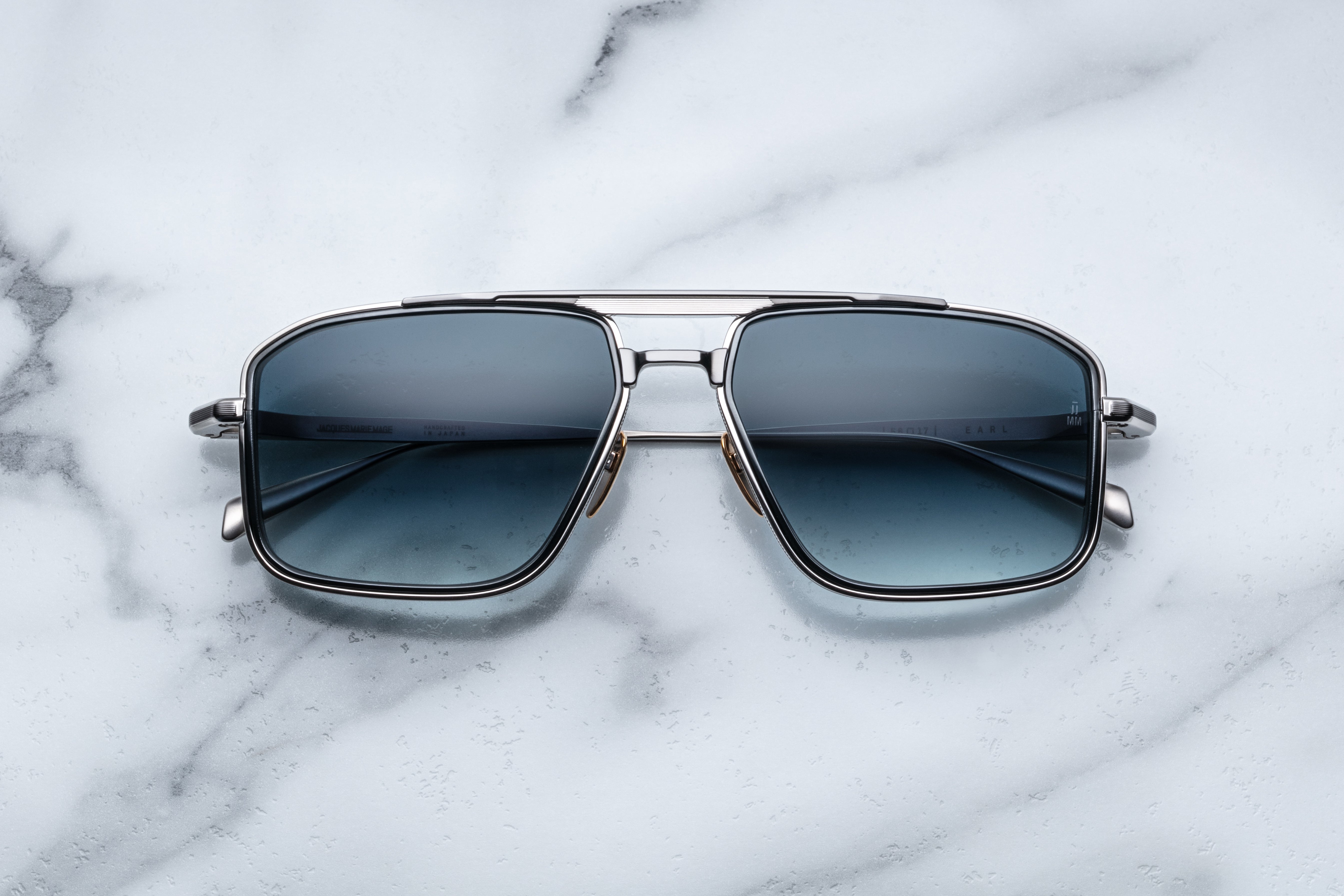 Jacques Marie Mage Earl Pacific sunglasses with sleek black frames and tinted lenses, front view showing stylish design.