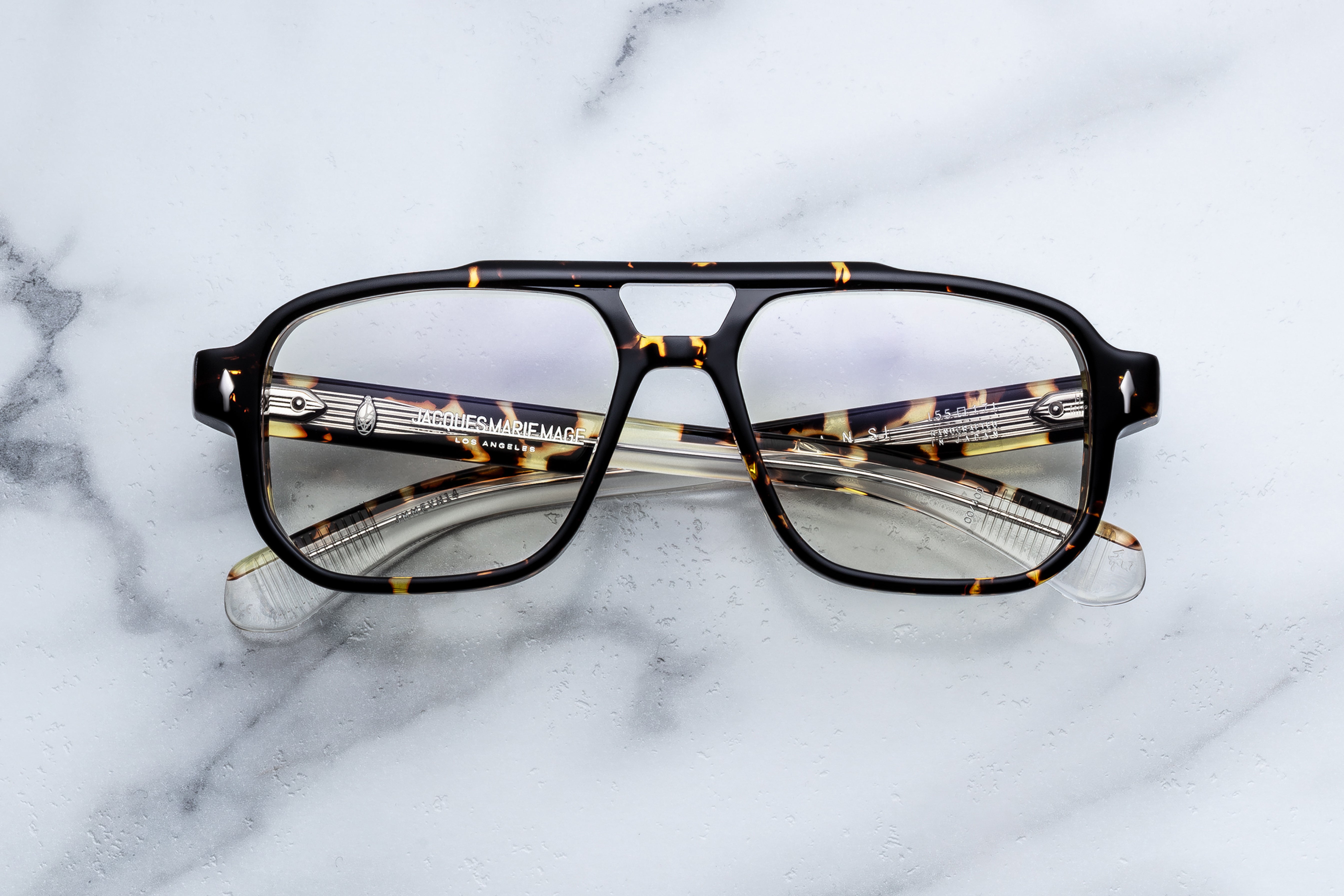 Jacques Marie Mage Evans RX optical glasses with clear frames and round lenses, front view.