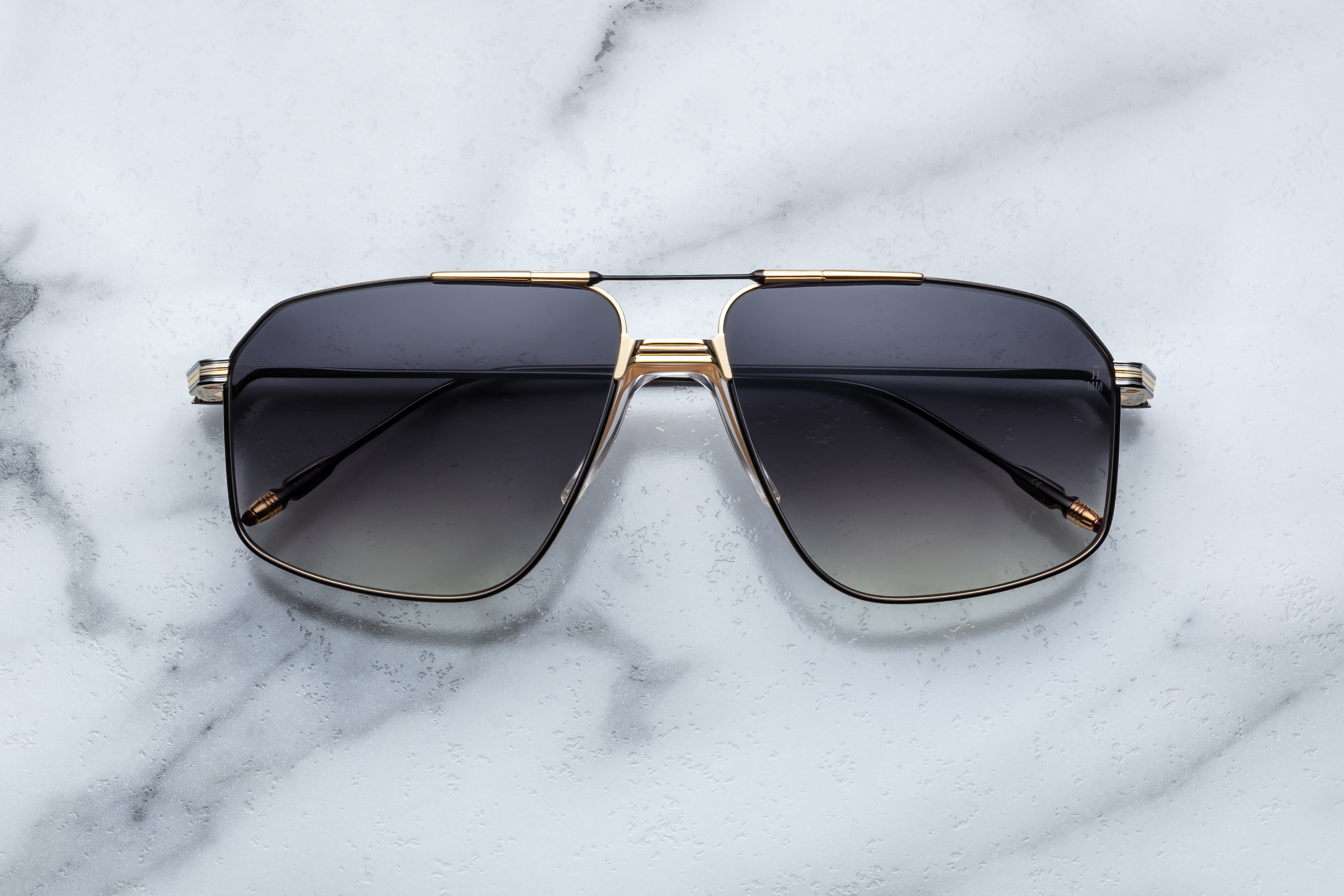 Jacques Marie Mage JAGGER sunglasses with bold black frames and tinted lenses, front view showing sleek design and modern style.