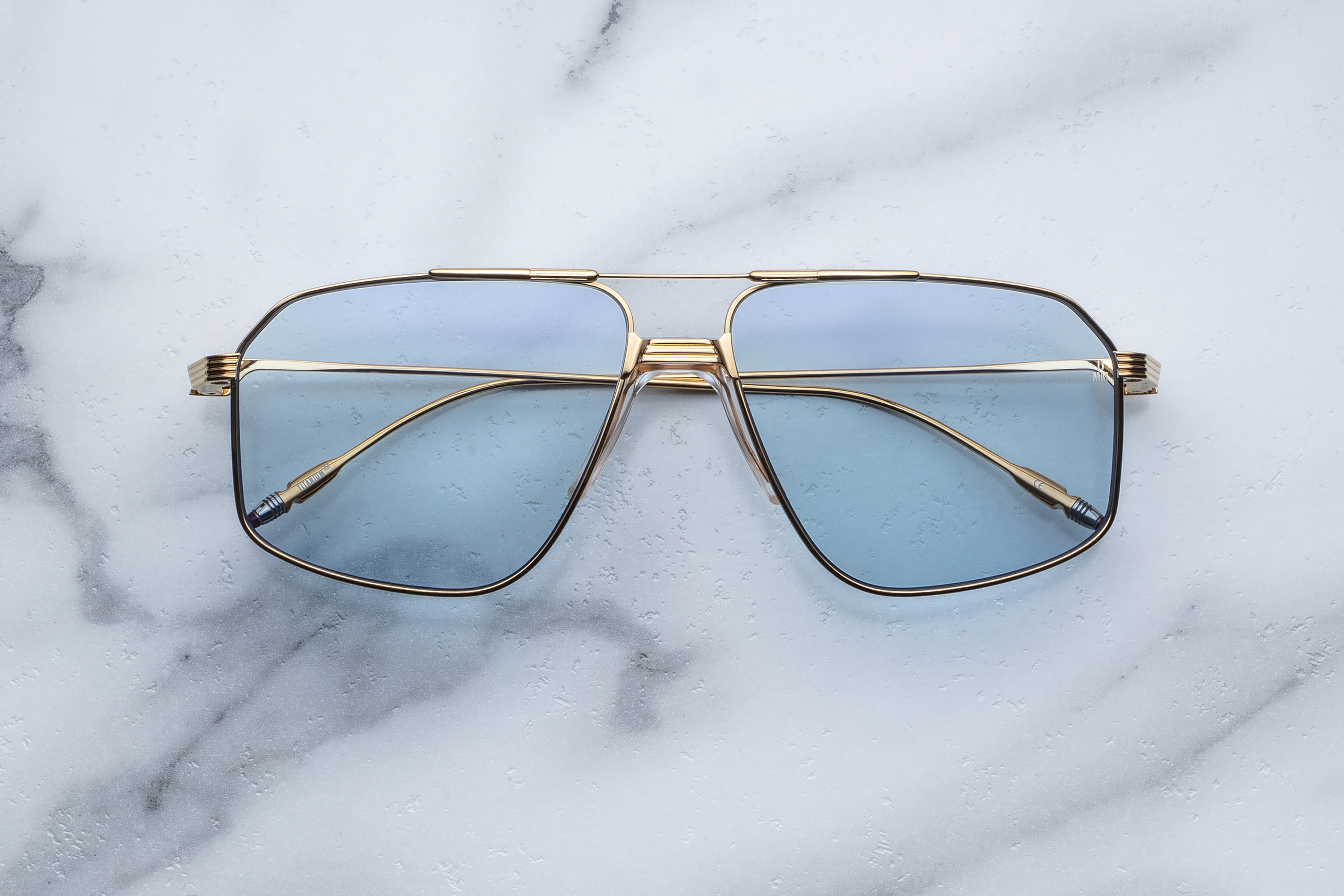 Jacques Marie Mage JAGGER sunglasses with Ciel frame, front view showcasing sleek design and clear lenses.