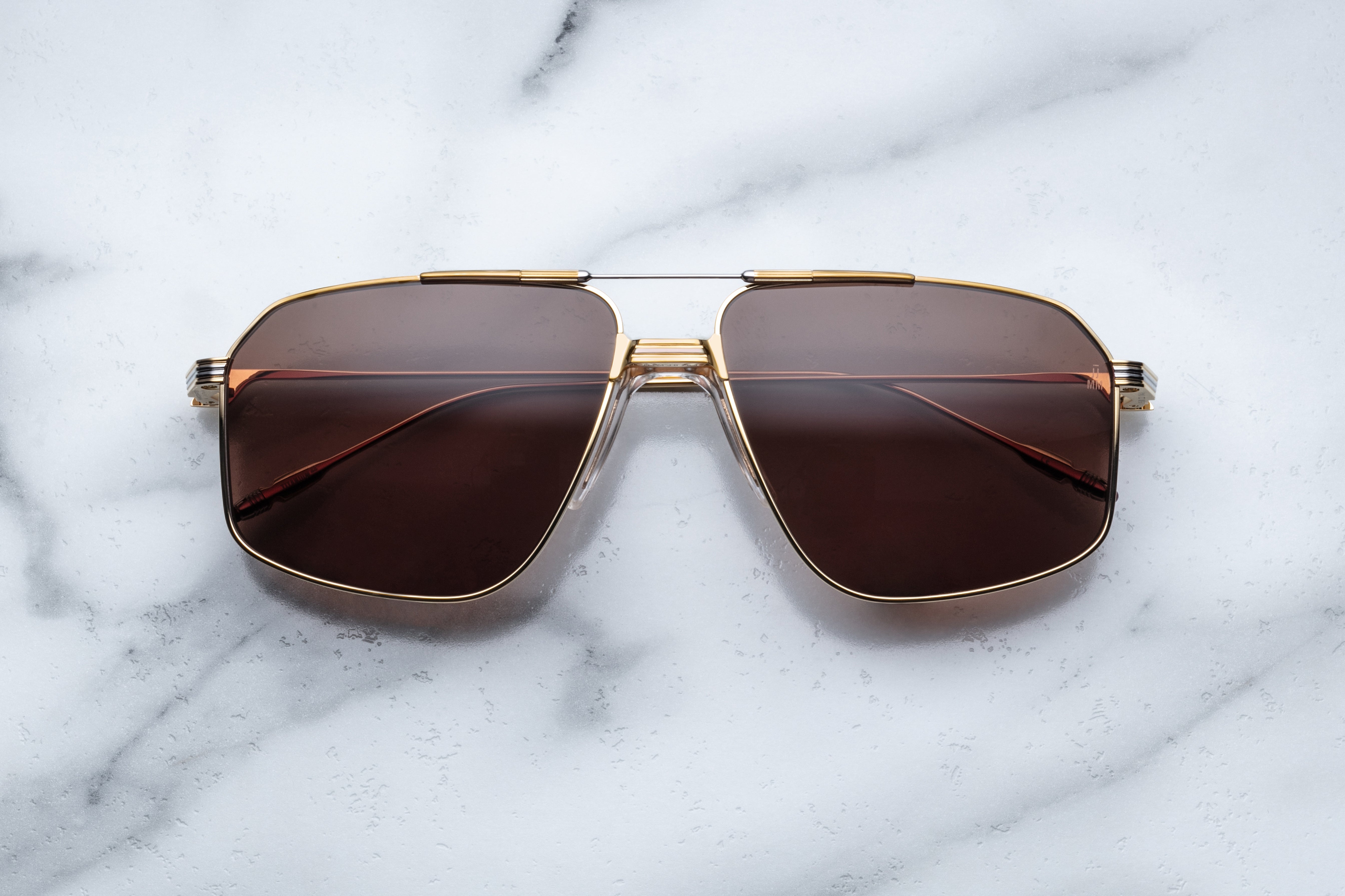 Jacques Marie Mage JAGGER sunglasses with rounded frames and brown tortoiseshell pattern, front view showing lenses and temples.