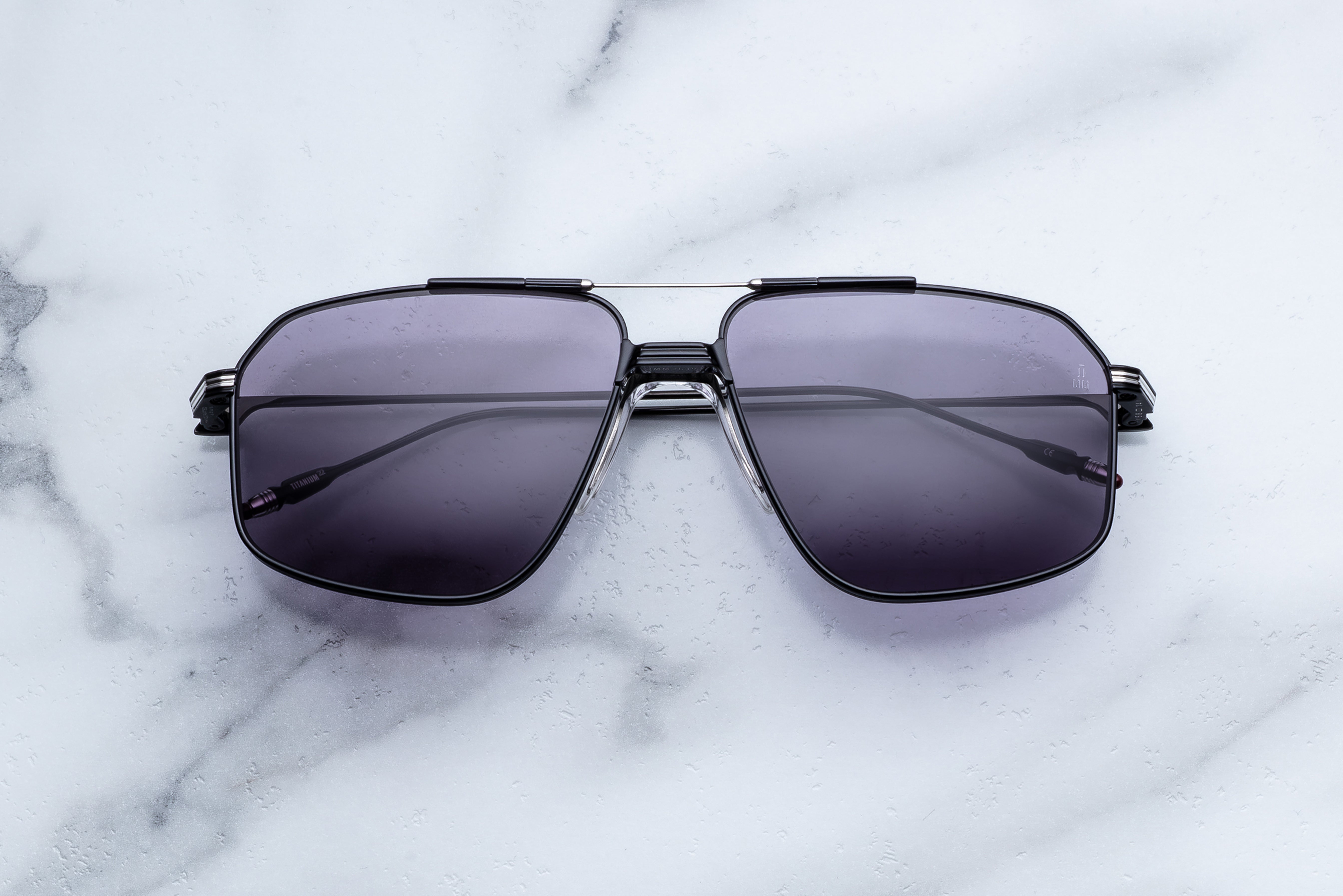 Jacques Marie Mage Jagger sunglasses with black frames and tinted lenses, front view showing stylish design.