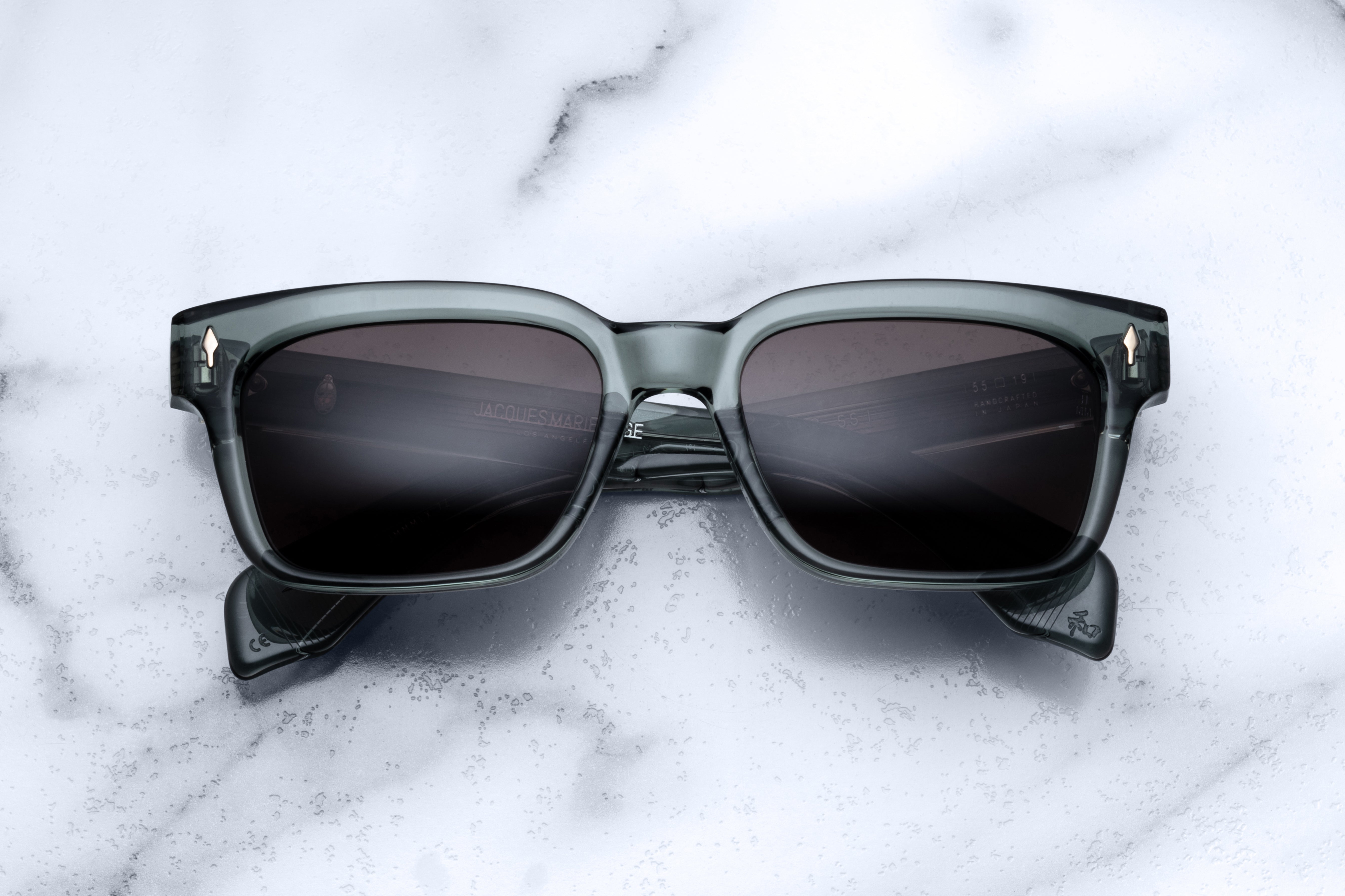 Jacques Marie Mage Molino 55 sunglasses with Juniper-colored frames and clear lenses, front view.