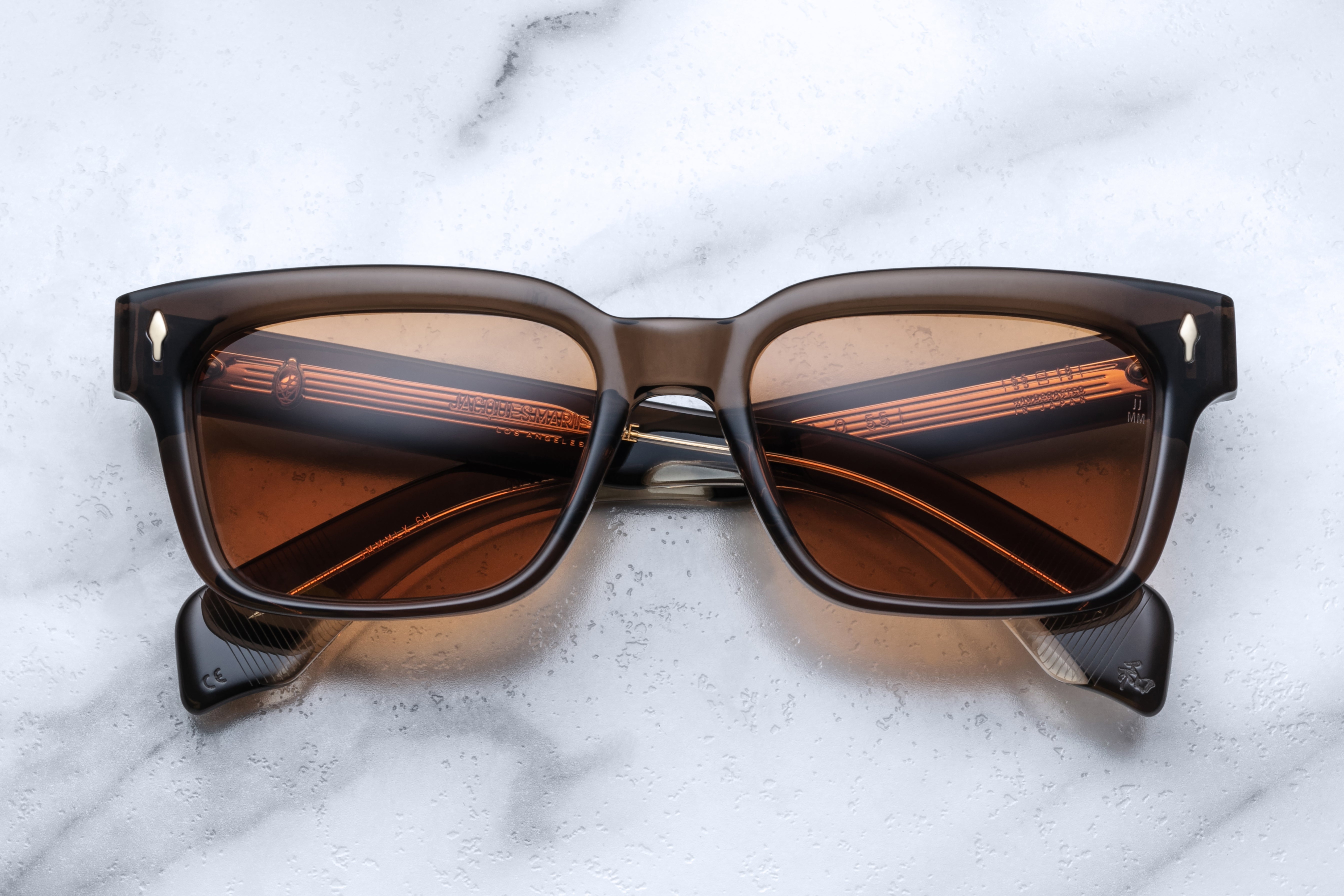 Jacques Marie Mage Molino 55 sunglasses with round frames and dark lenses, shown from the front view.