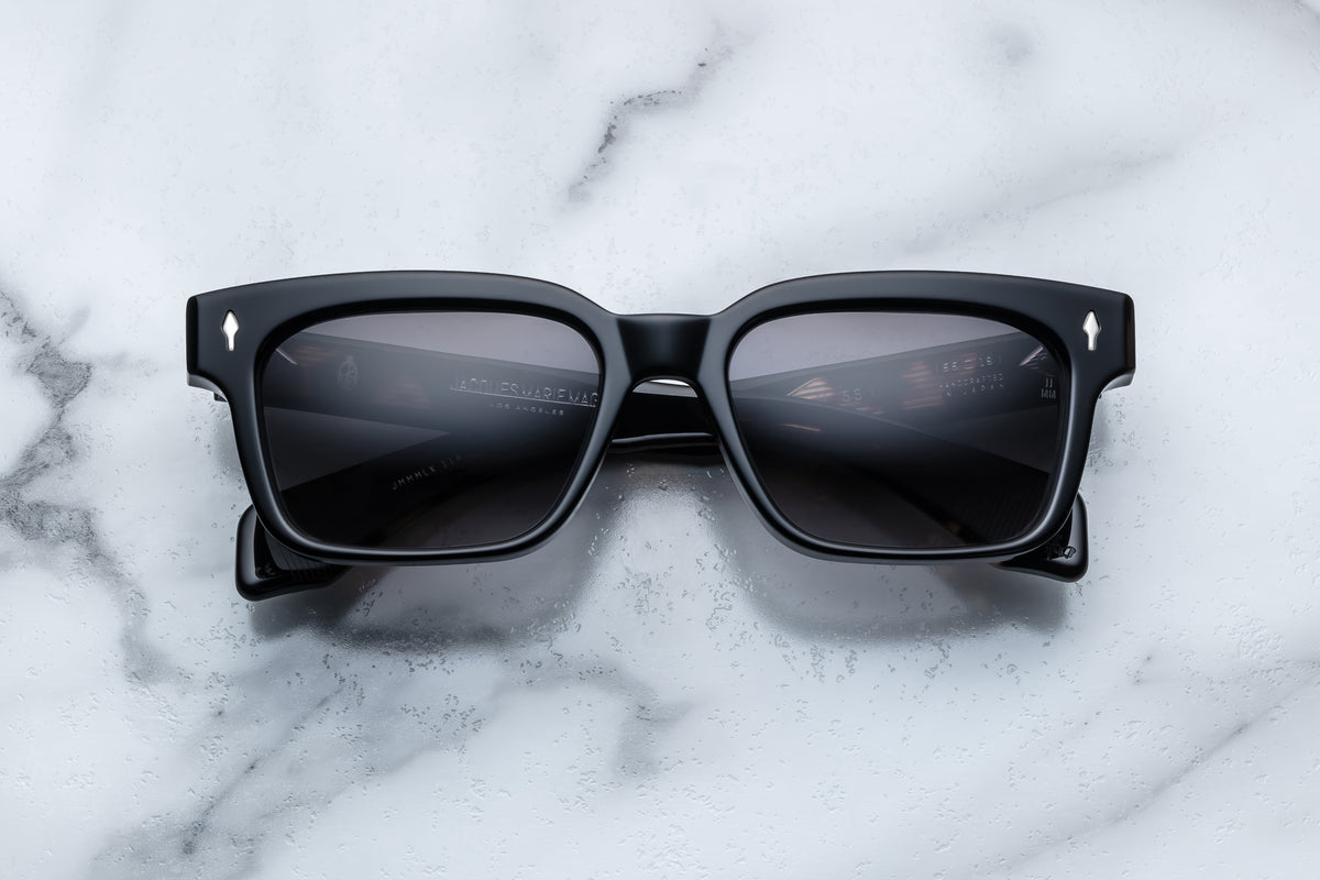 Jacques Marie Mage Molino 55 sunglasses with black frame and sleek design, front view showing lens and stylish details.