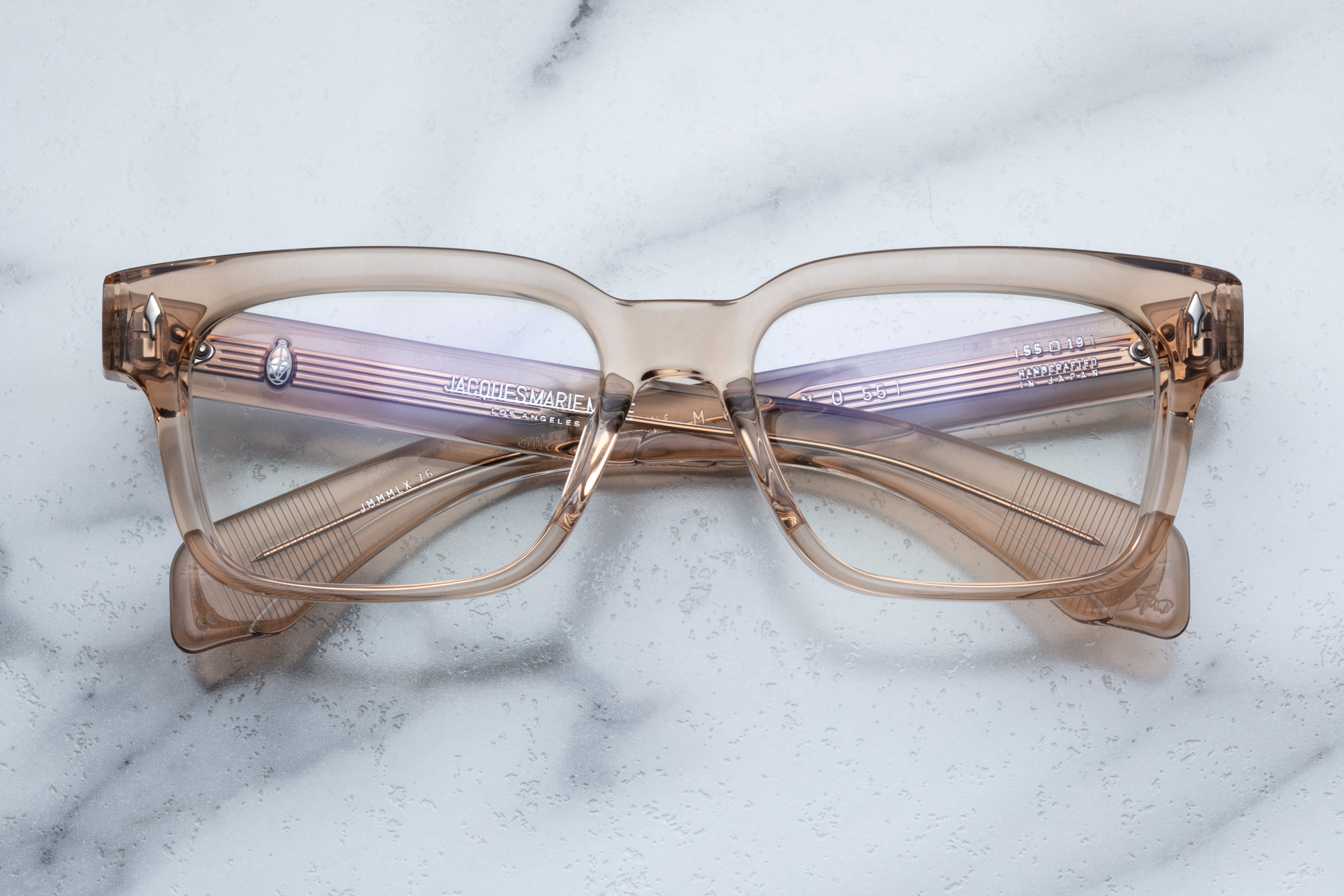Jacques Marie Mage Molino 55 optical glasses with sand-colored frames and clear lenses, front view showing sleek design.