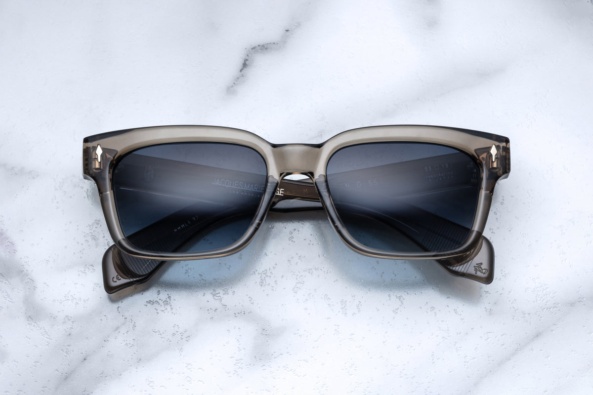Jacques Marie Mage Molino 55 taupe sunglasses with rounded frame and tinted lenses, front view showing stylish eyewear design.