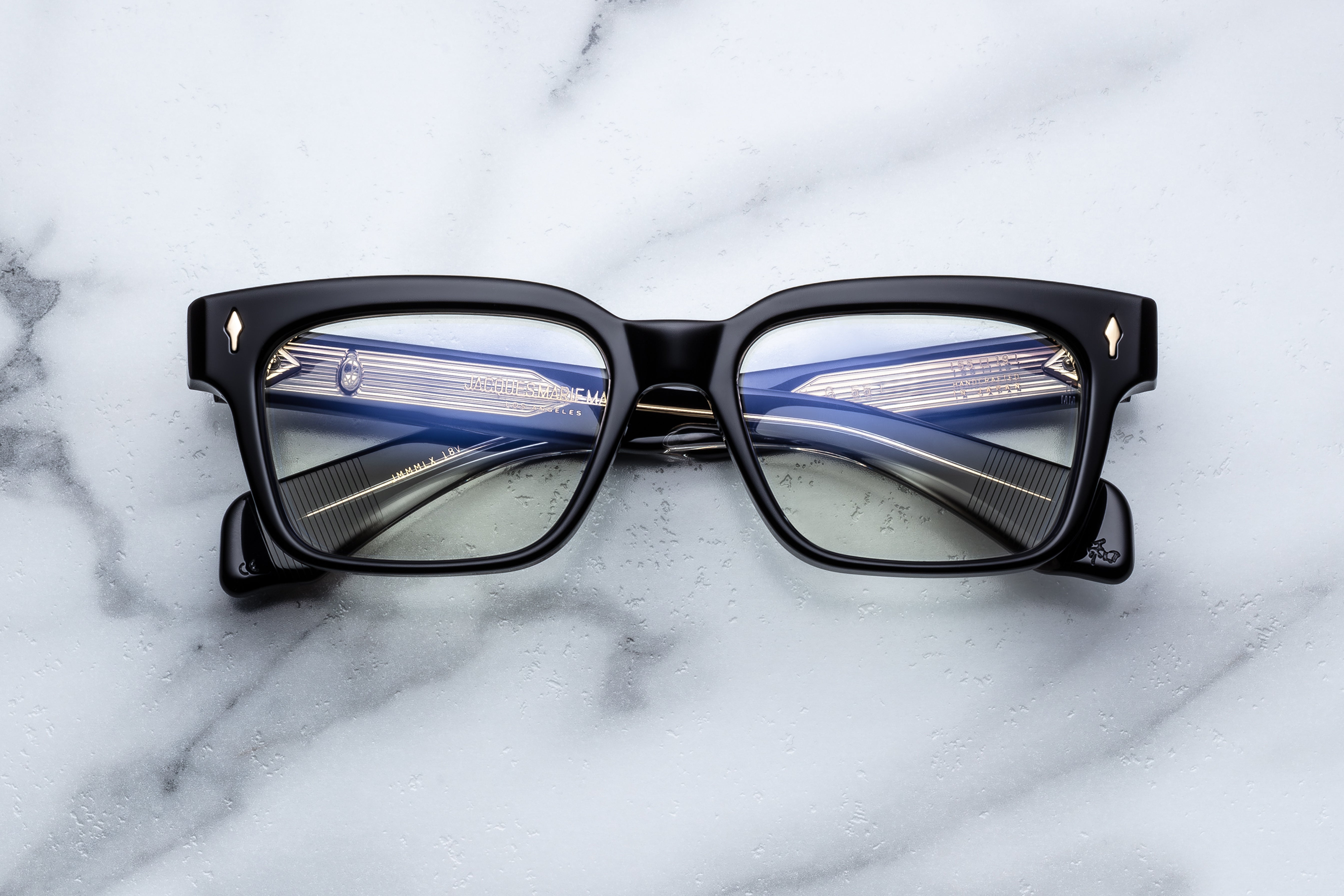 Optical eyewear MOLINO 55 by Jacques Marie Mage with venom-inspired design, front view showing sleek frame and detailed accents.