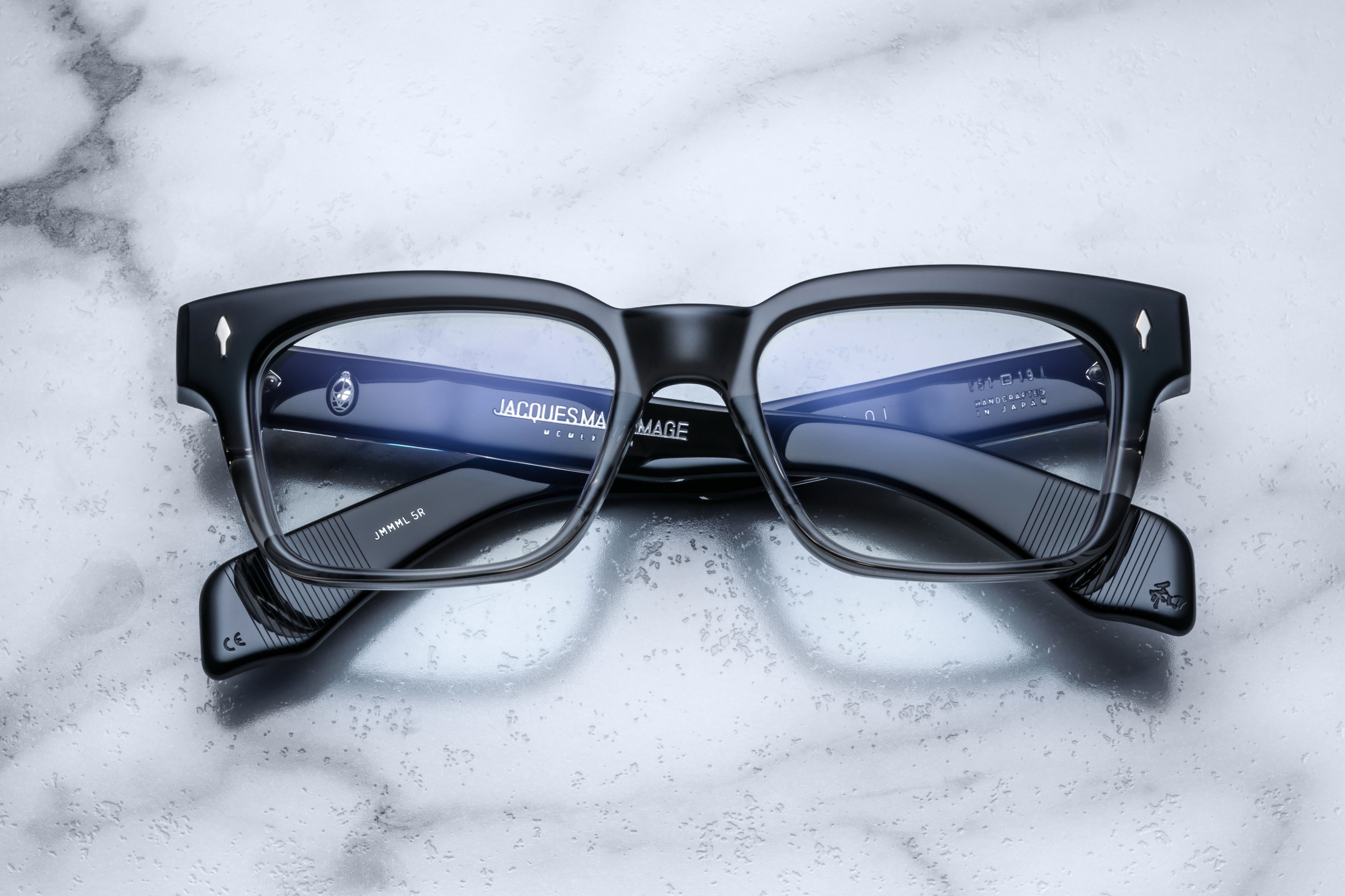 Jacques Marie Mage Molino optical glasses in black fade with clear lenses, front view showing sleek frame design.