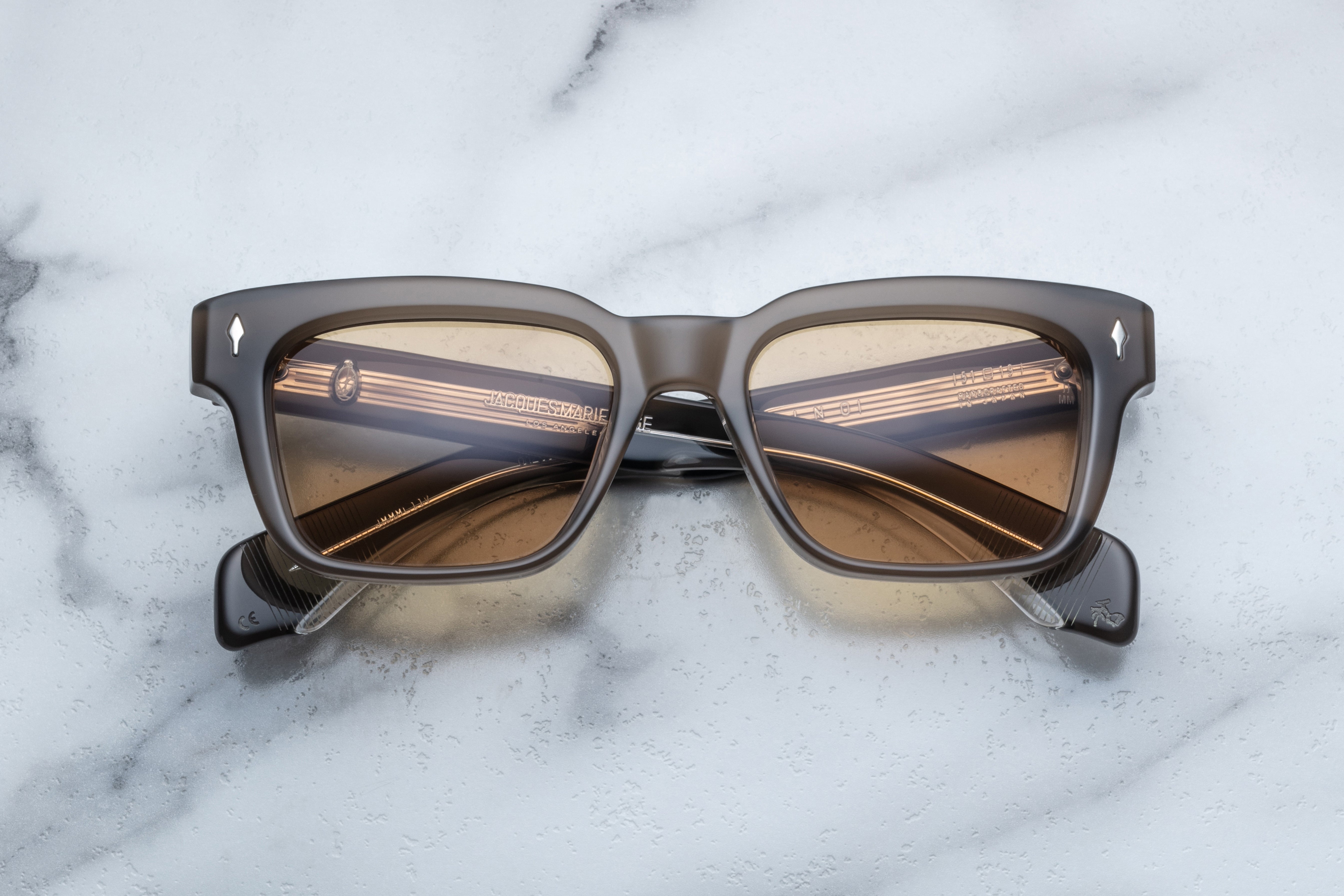 Jacques Marie Mage Molino sunglasses with a sleek front view, featuring modern design and dark tinted lenses.