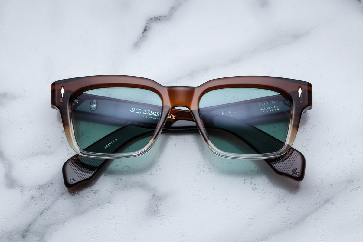 Jacques Marie Mage Molino sunglasses with hickory fade frame and clear lenses, front view showcasing stylish eyewear design.