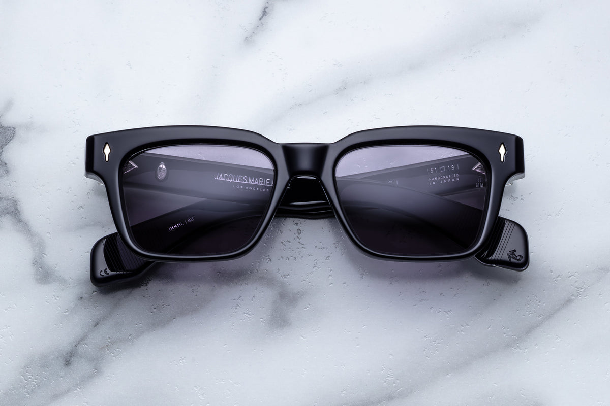 Jacques Marie Mage Molino sunglasses with rounded frames and dark lenses, close-up front view.