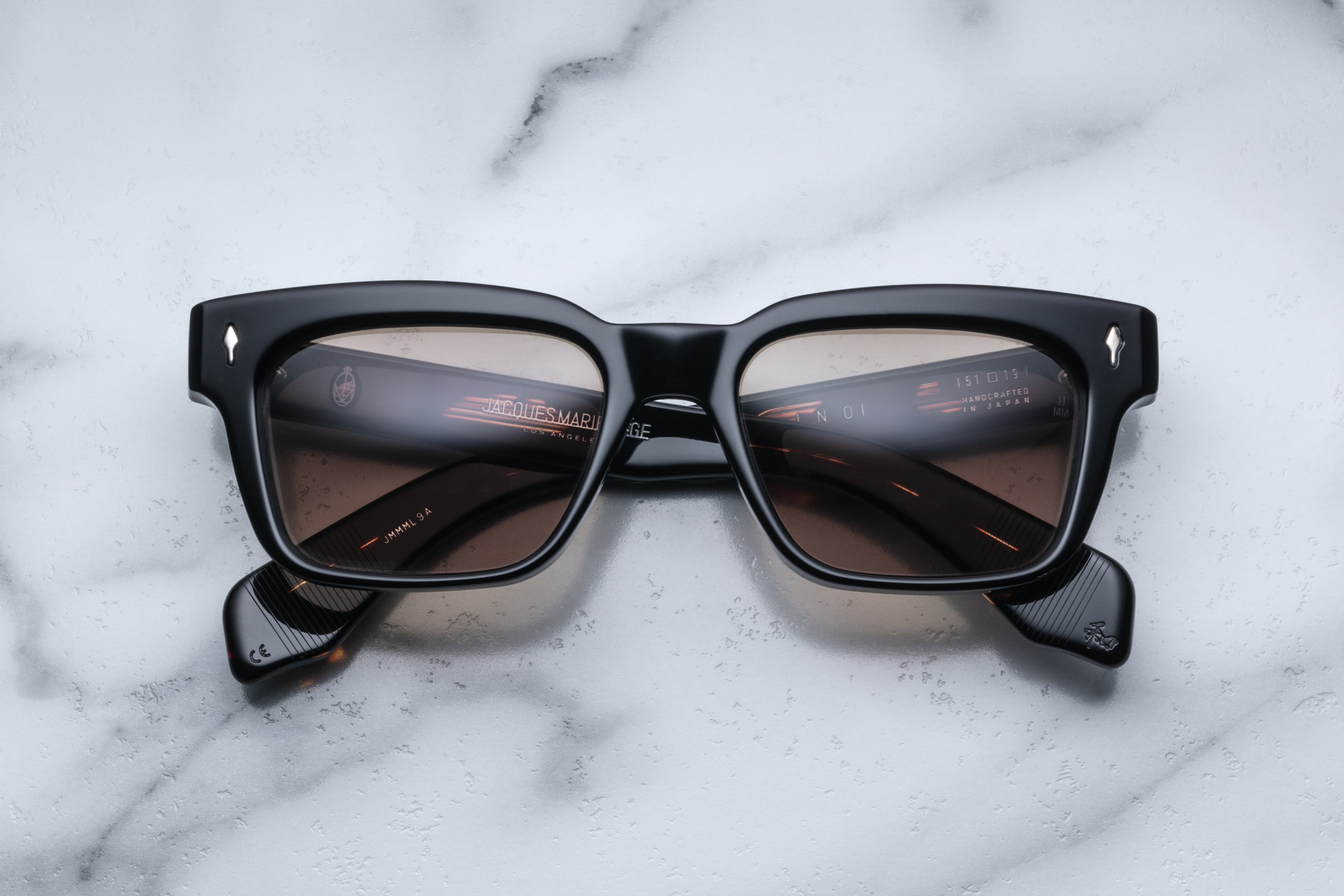 Jacques Marie Mage Molino Noir sunglasses with black frames and clear lenses, front view showcasing stylish design.