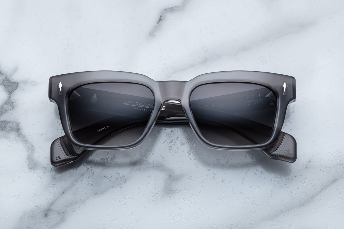 Jacques Marie Mage Molino sunglasses with a sleek front view, showcasing black frames and tinted lenses.