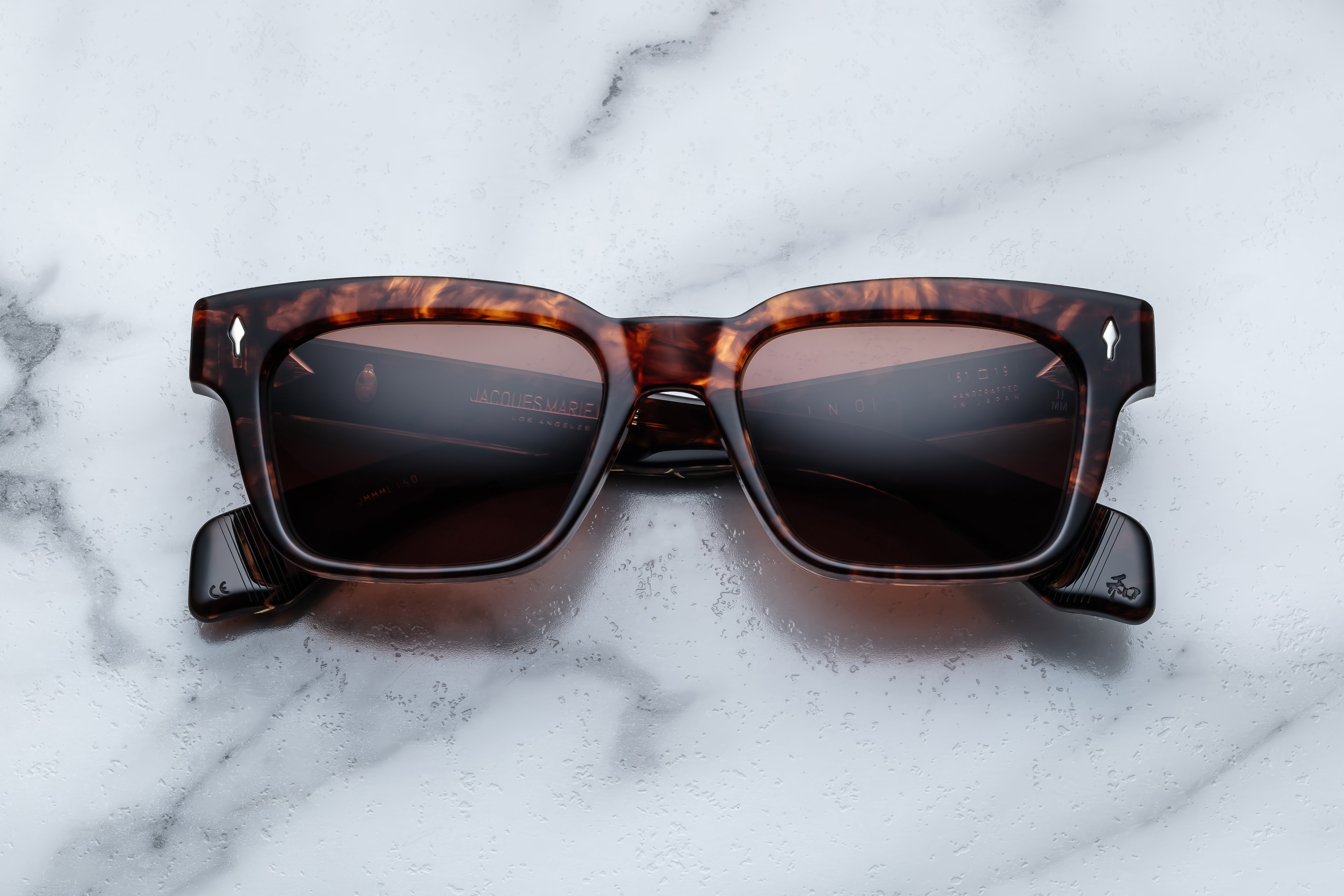 Jacques Marie Mage Molino sunglasses with rounded frames and dark tinted lenses, front view showing stylish design.