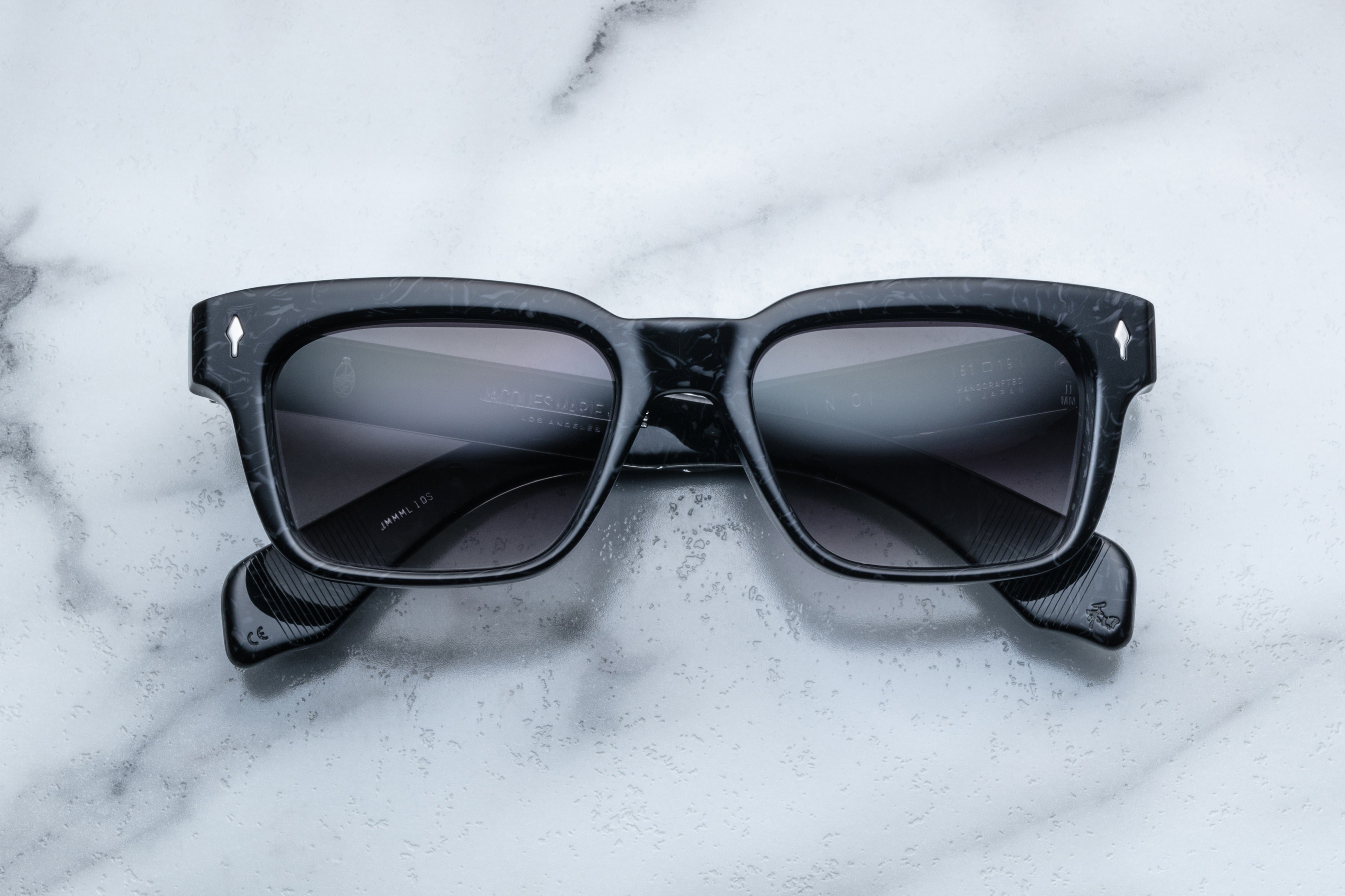 Jacques Marie Mage Molino slate sunglasses with rounded frames and clear lenses, front view showing sleek design.