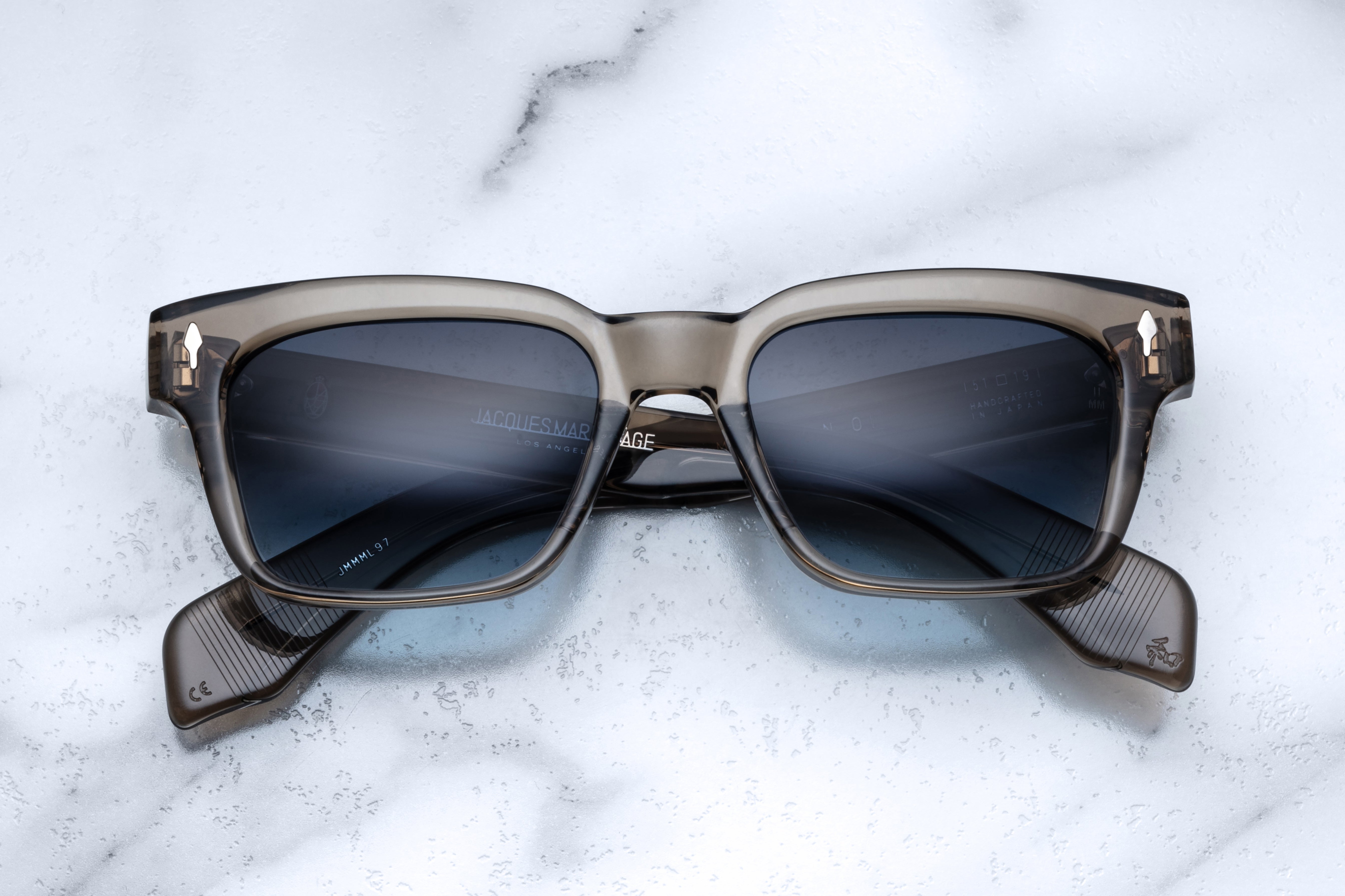 Jacques Marie Mage Molino taupe sunglasses with rounded frames and clear lenses, front view showing stylish design