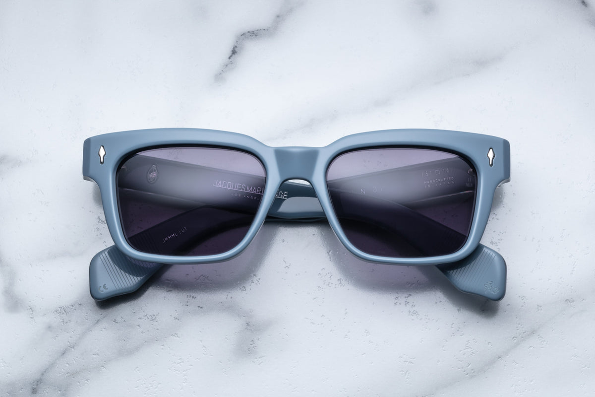 Jacques Marie Mage Molino Tiger sunglasses with tortoise shell frames and clear lenses, front view showing stylish design.