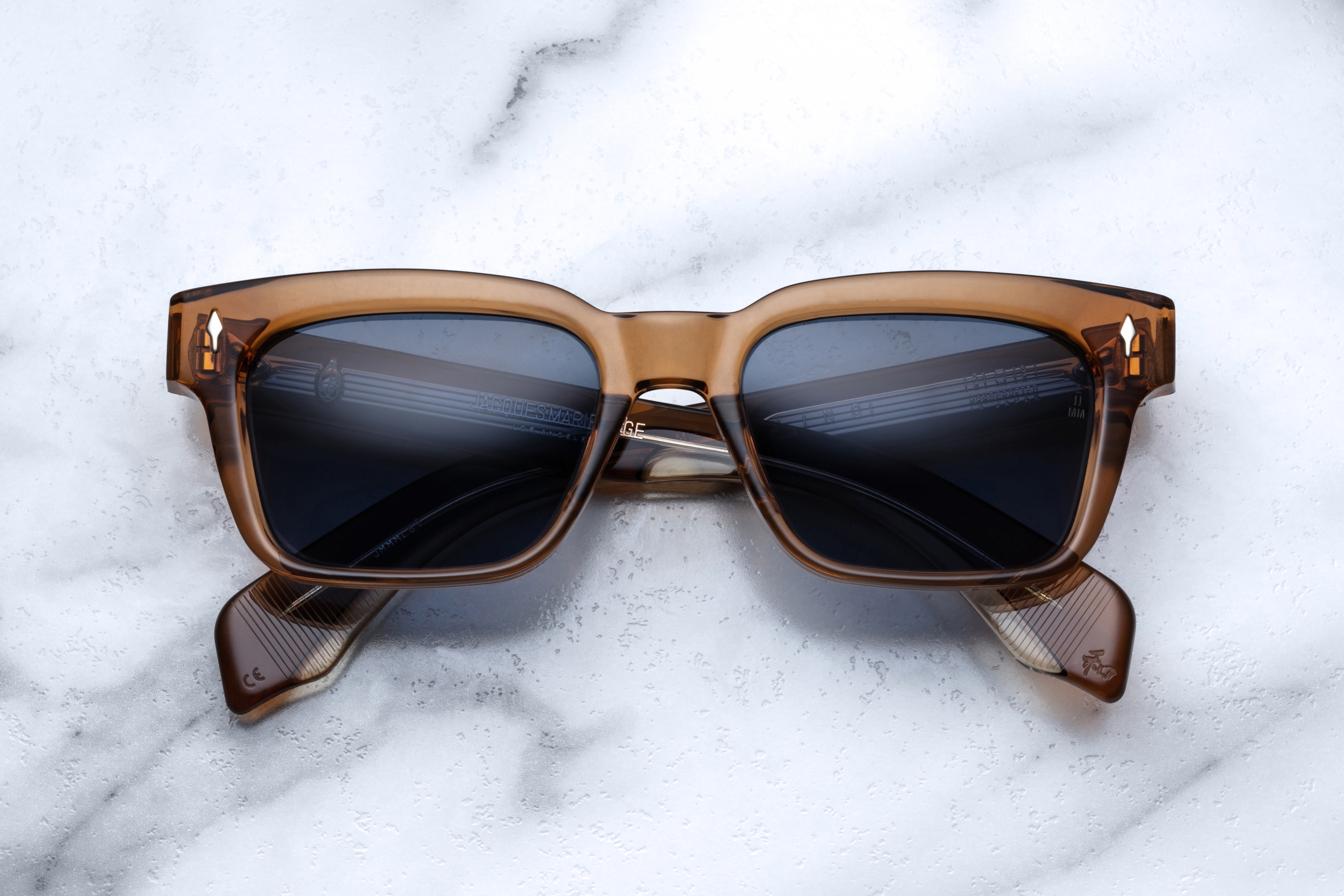 Jacques Marie Mage Molino whiskey sunglasses with round frames and tinted lenses, shown from the front view.