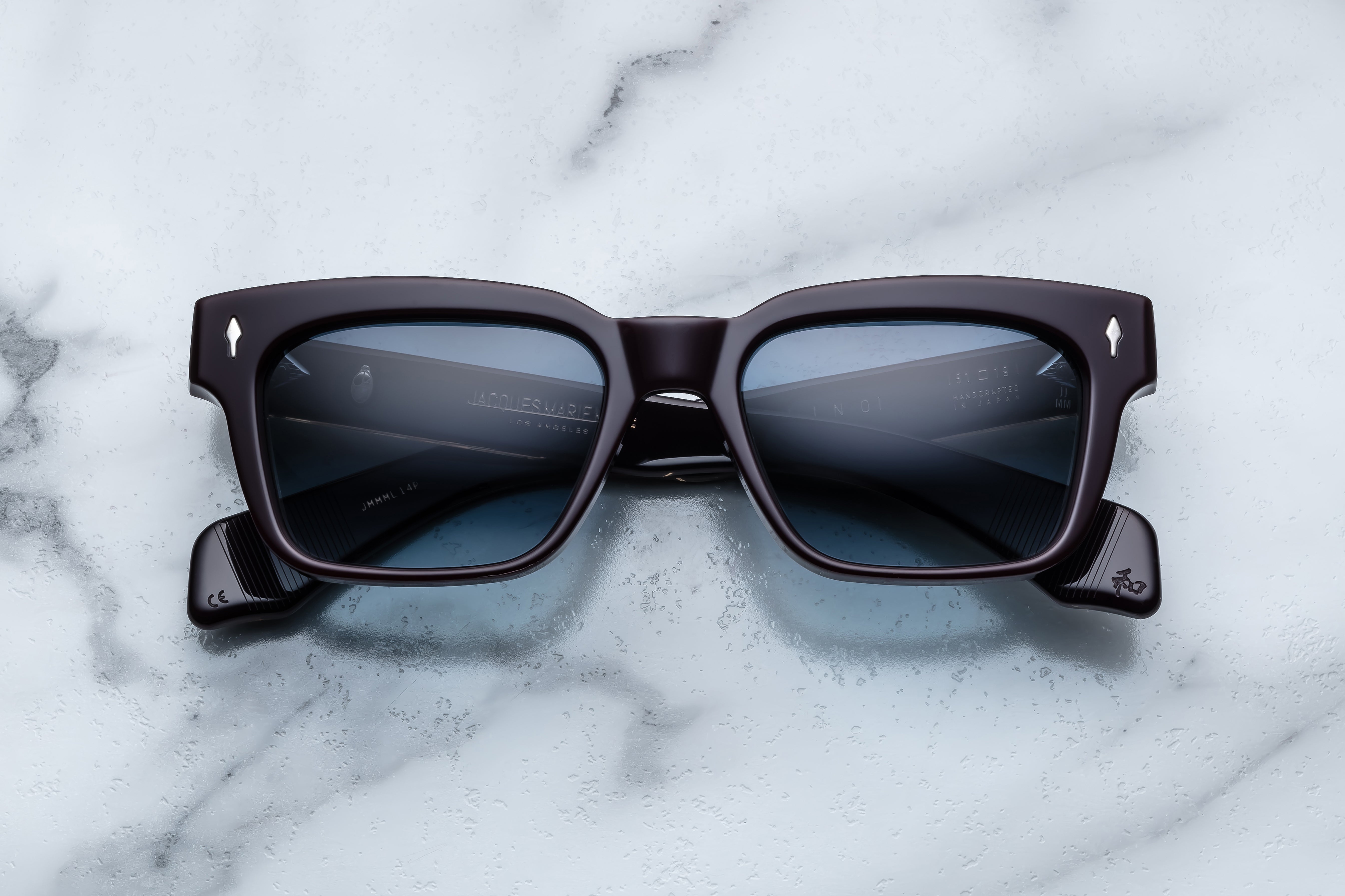 Jacques Marie Mage Molino sunglasses with a sleek front view, featuring wine-colored frames and stylish design.
