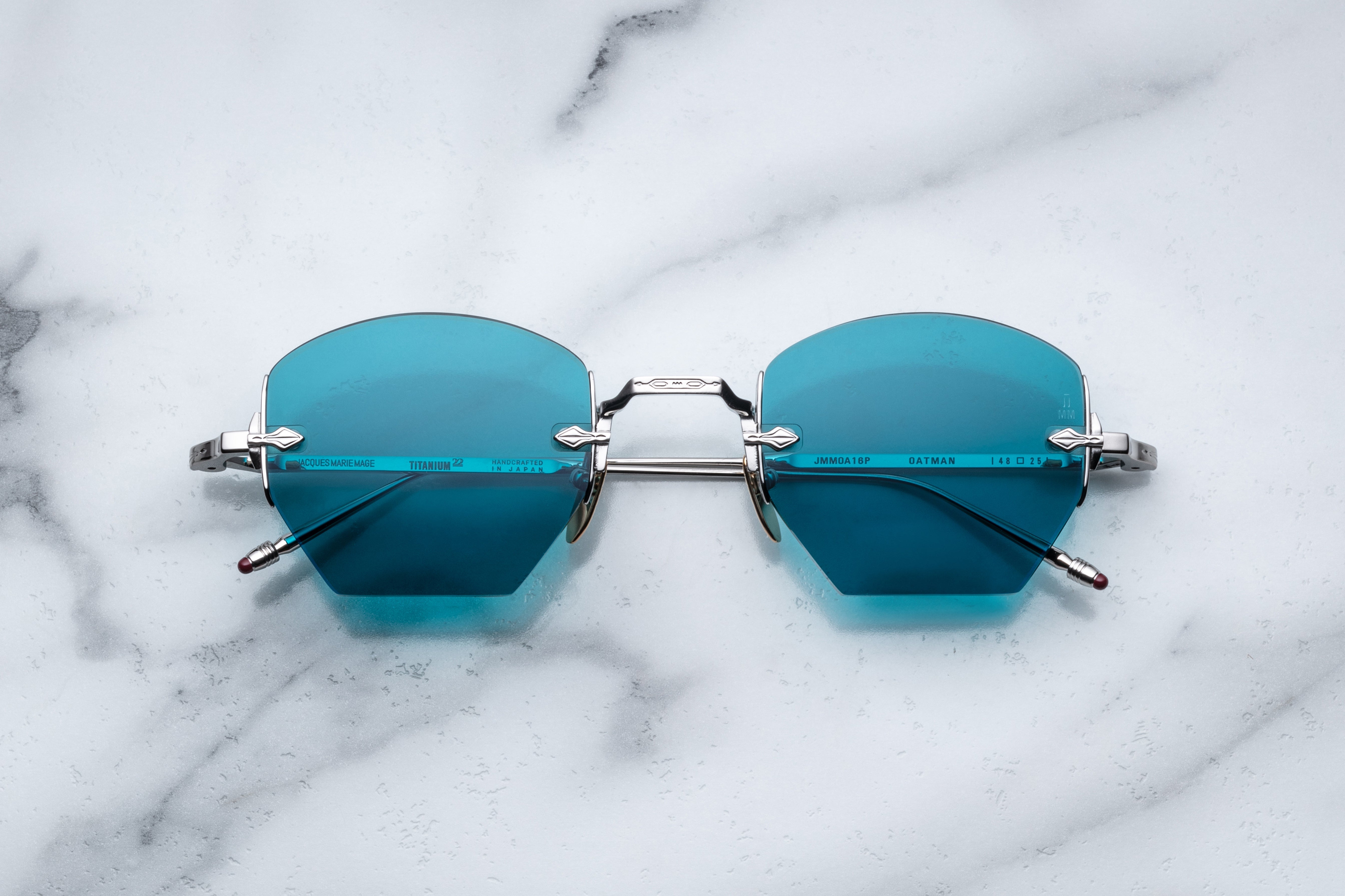 Jacques Marie Mage OATMAN sunglasses with round frames and tinted lenses, shown from the front view.