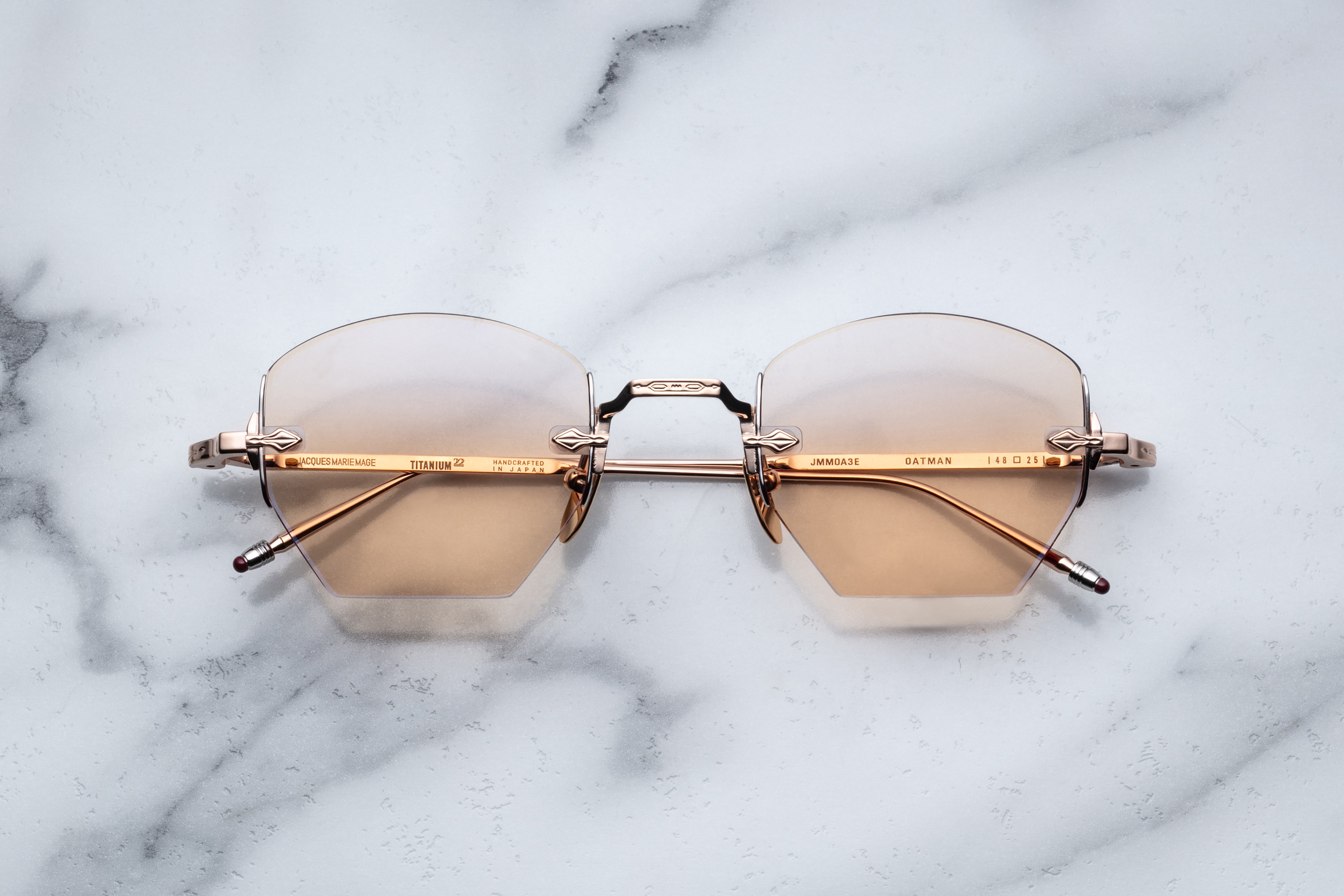 Jacques Marie Mage Oatman sunglasses with rose gold frames, front view showing stylish and modern design.