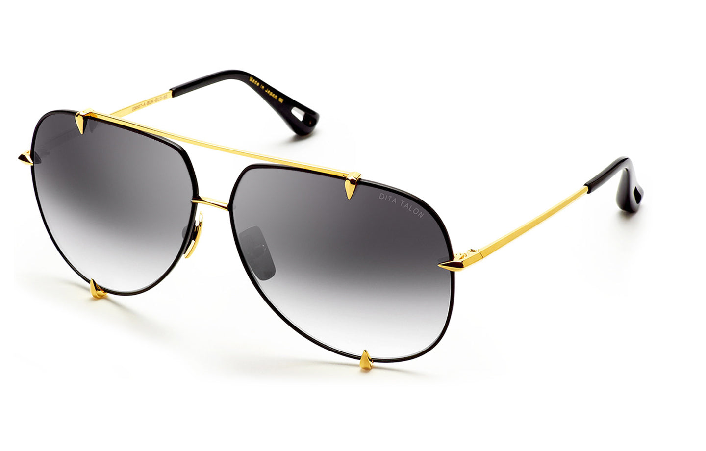 Dita TALON sunglasses with black frames, gold accents, and angled design, shown from an angled view.