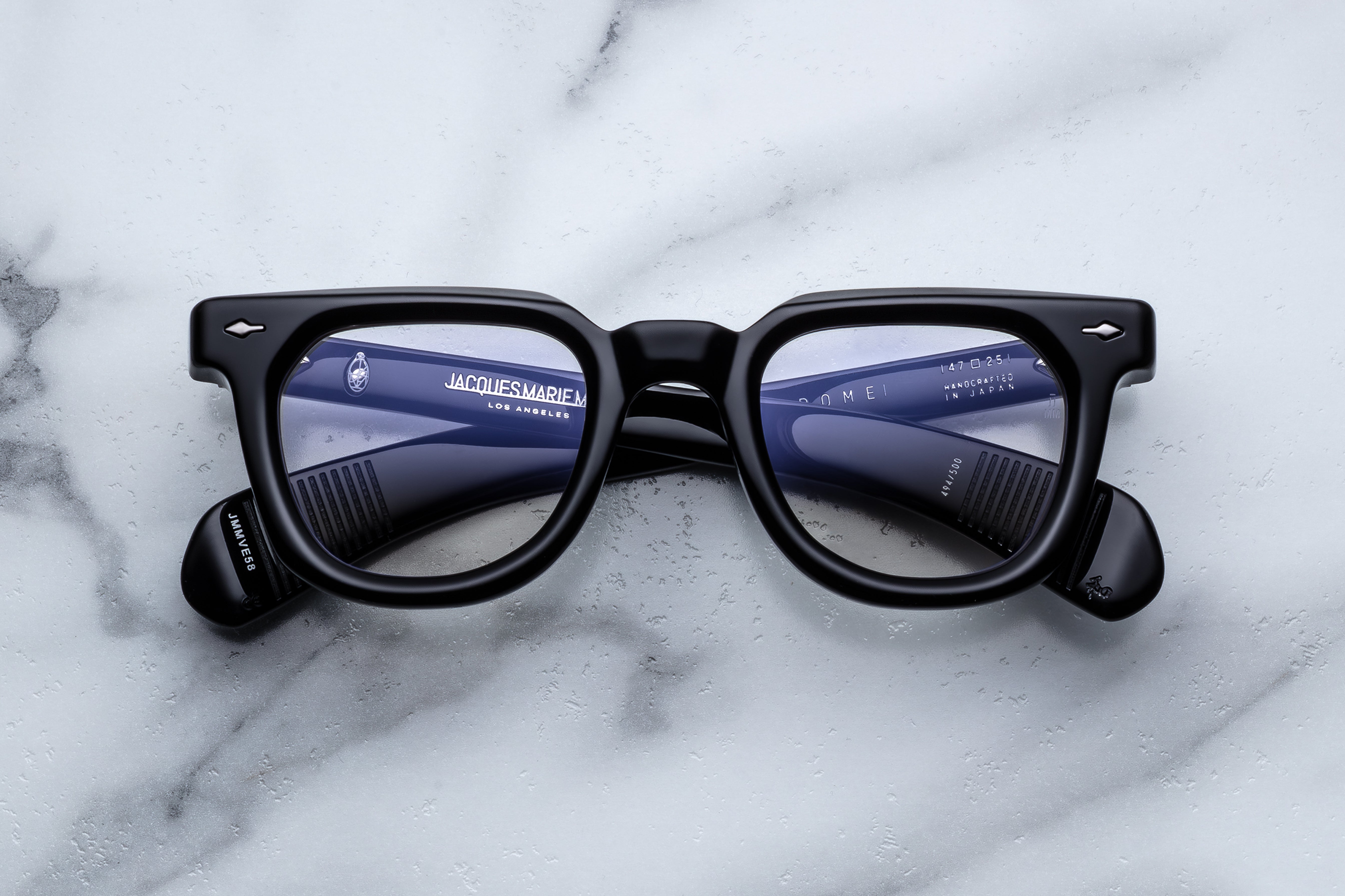 Jacques Marie Mage Vendome Raven optical glasses with black frames and clear lenses, front view.
