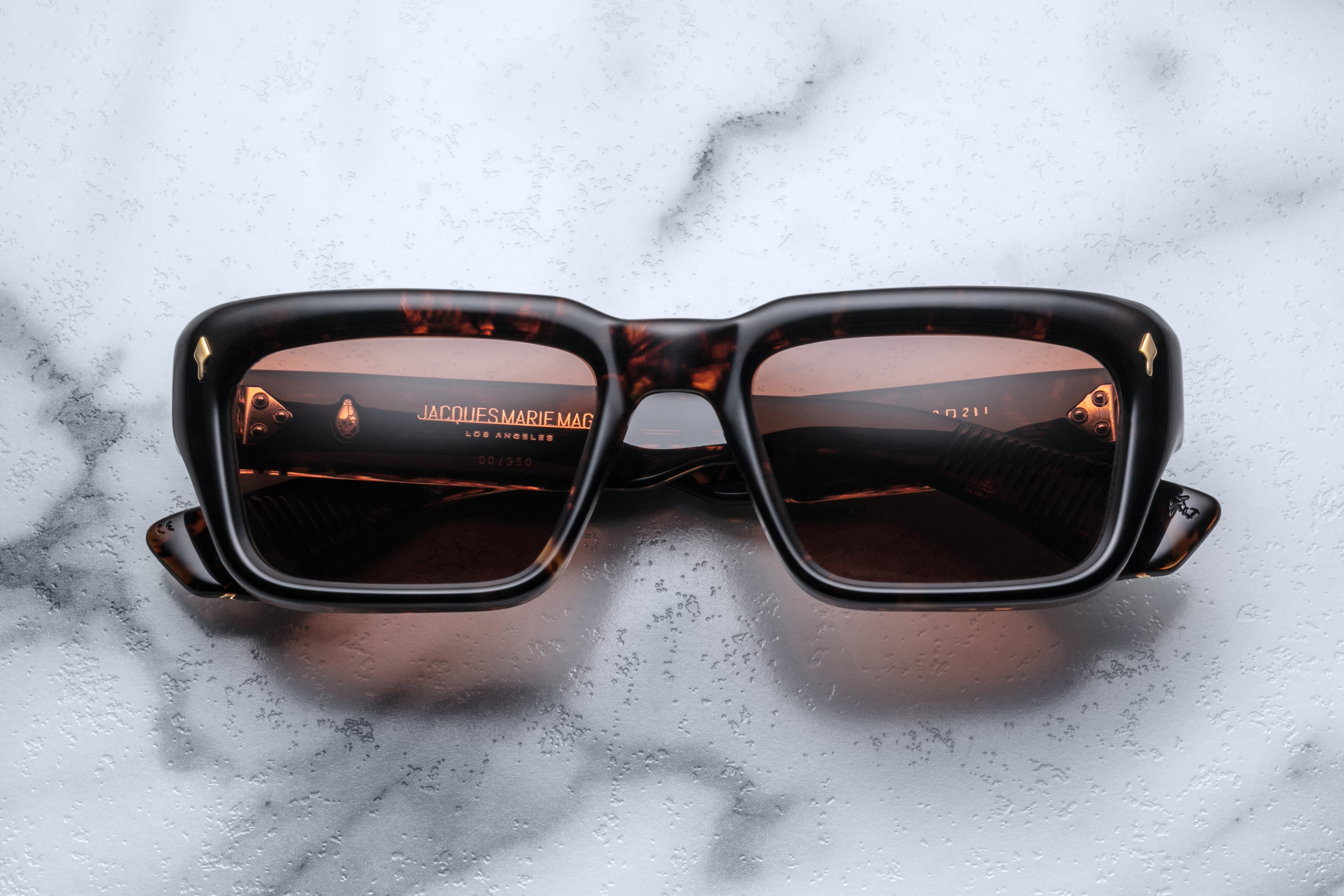 Jacques Marie Mage Walker sunglasses featuring dark tinted lenses and sleek black frames, front view.