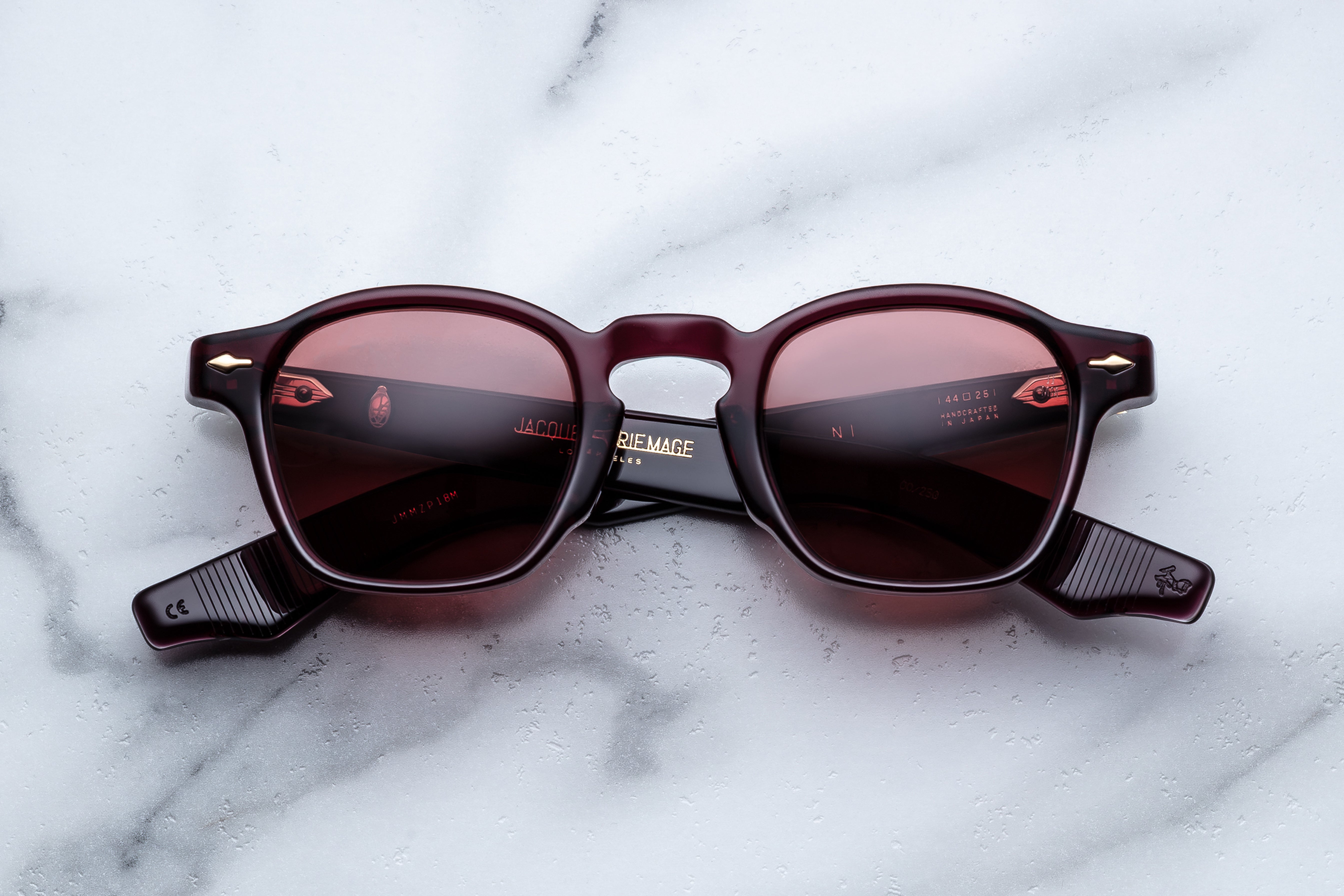 Jacques Marie Mage Zephirin sunglasses with amarena-colored frames and rounded lenses, front view.