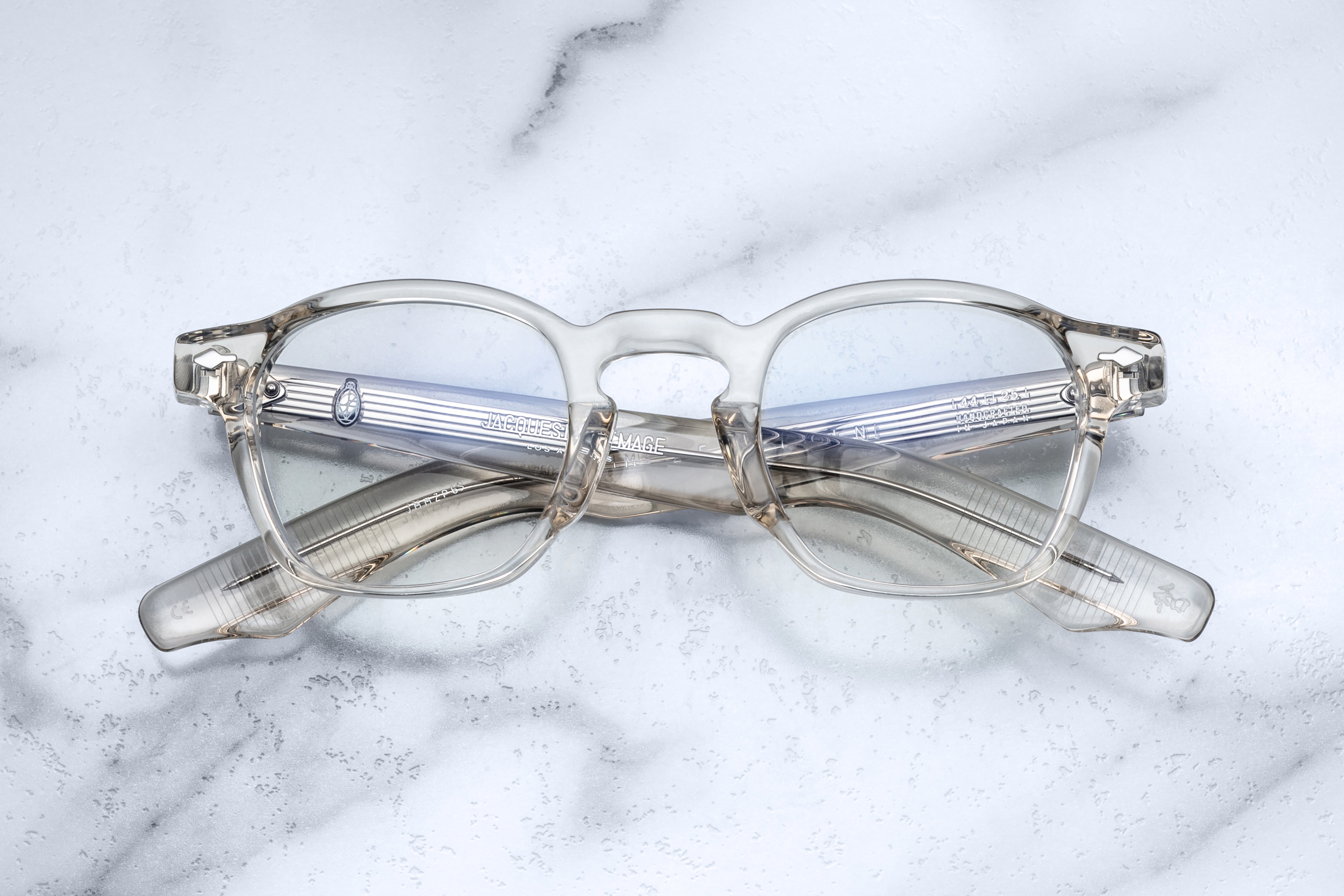 Jacques Marie Mage Zephirin beige optical glasses with round frames and clear lenses, front view.