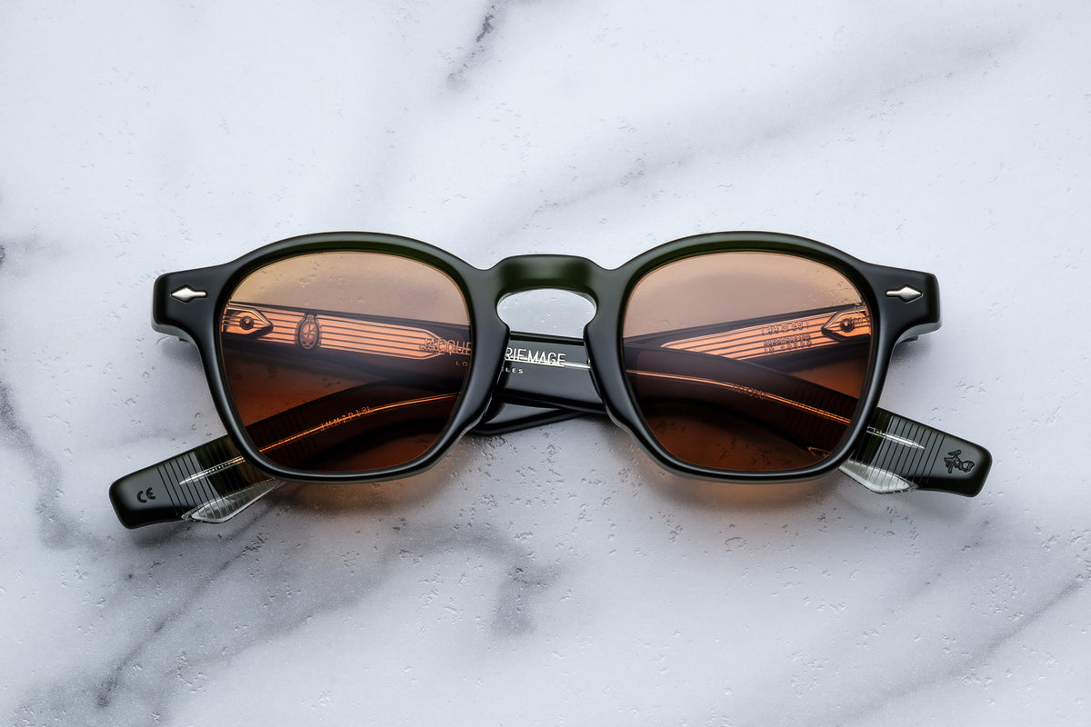 Jacques Marie Mage Zephirin Borneo sunglasses with round frames and dark lenses, front view.