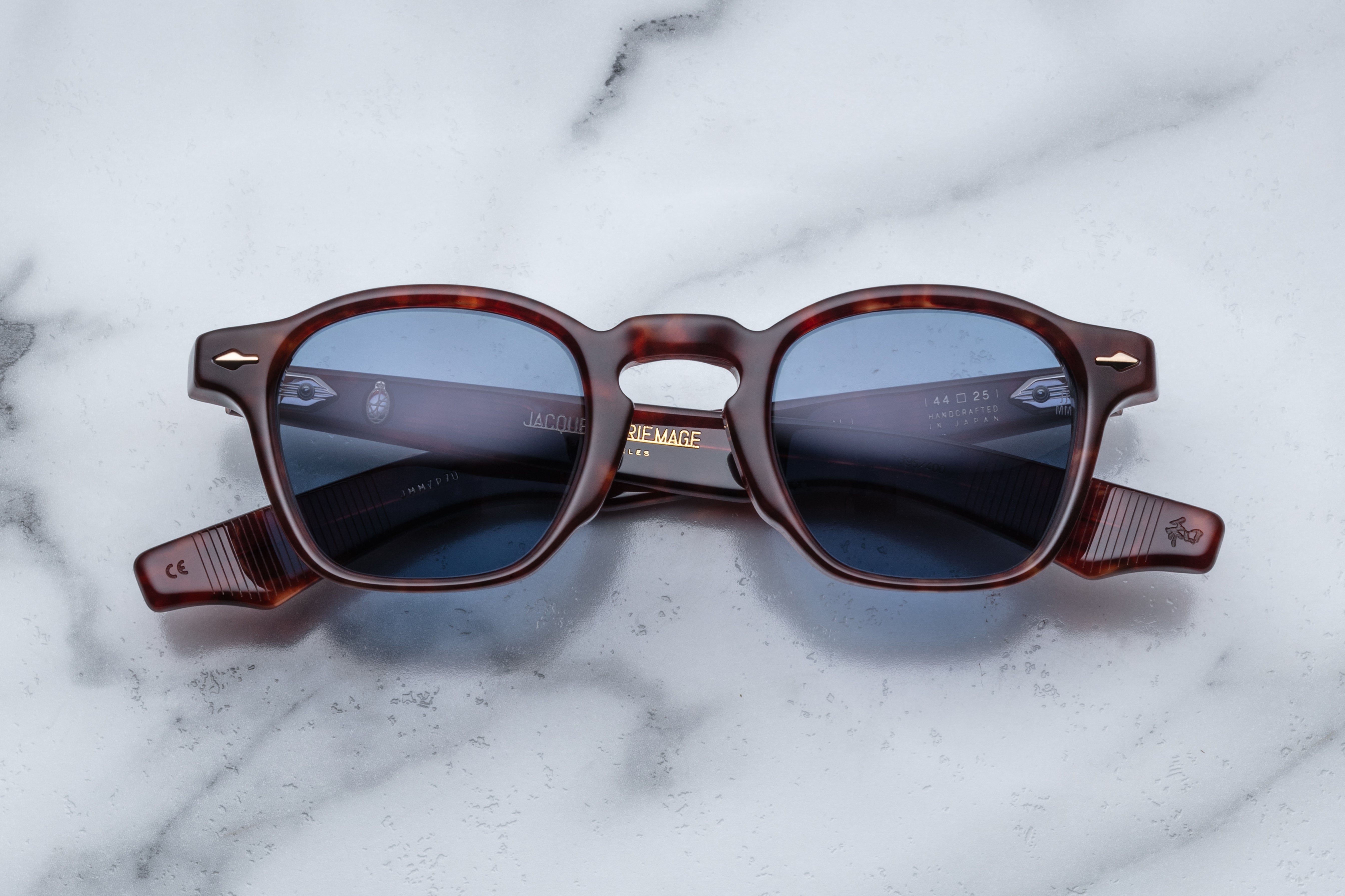 Jacques Marie Mage Zephirin sunglasses with sleek black frames and tinted lenses, shown from the front.