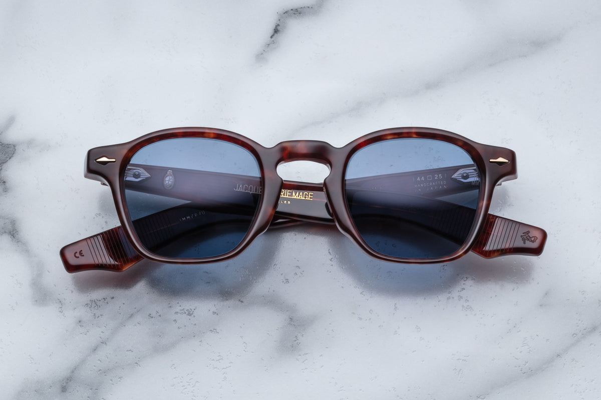 Jacques Marie Mage Zephirin sunglasses with sleek, rounded frames and dark tinted lenses, front view.