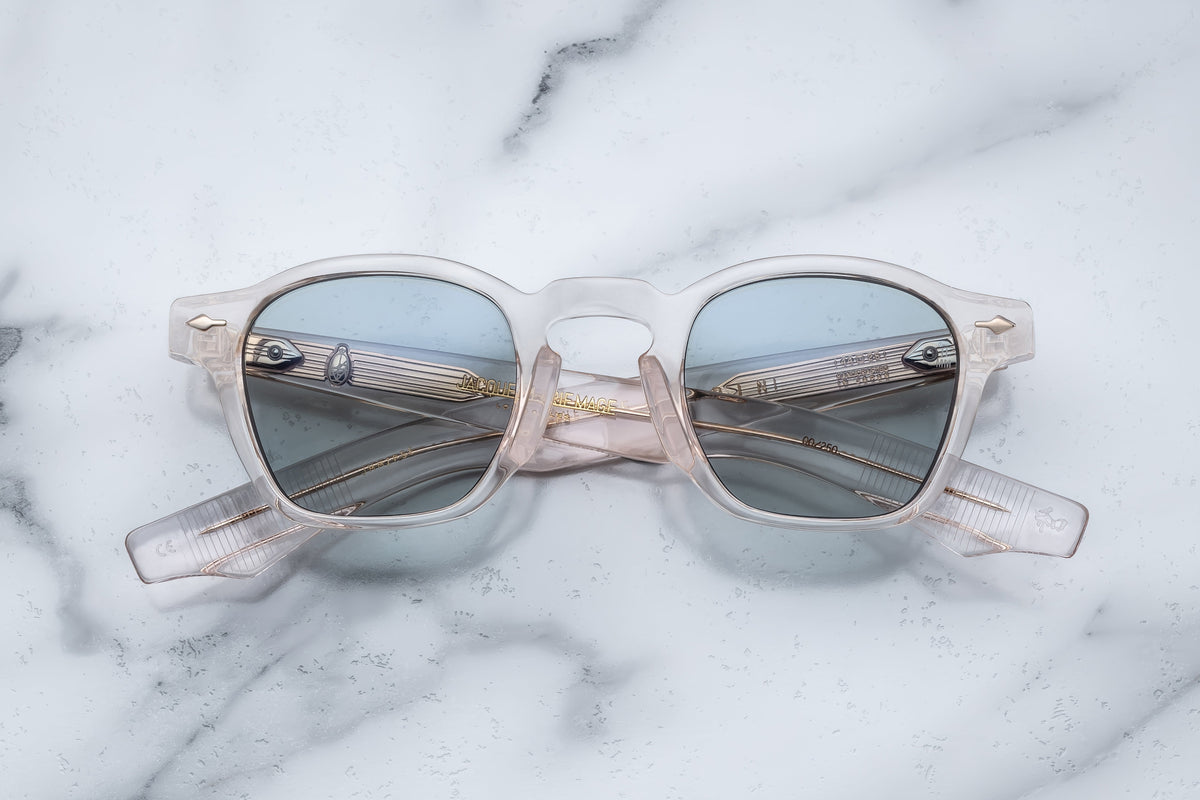 Jacques Marie Mage Zephirin sunglasses with cameo-colored frames and clear lenses, close-up front view.