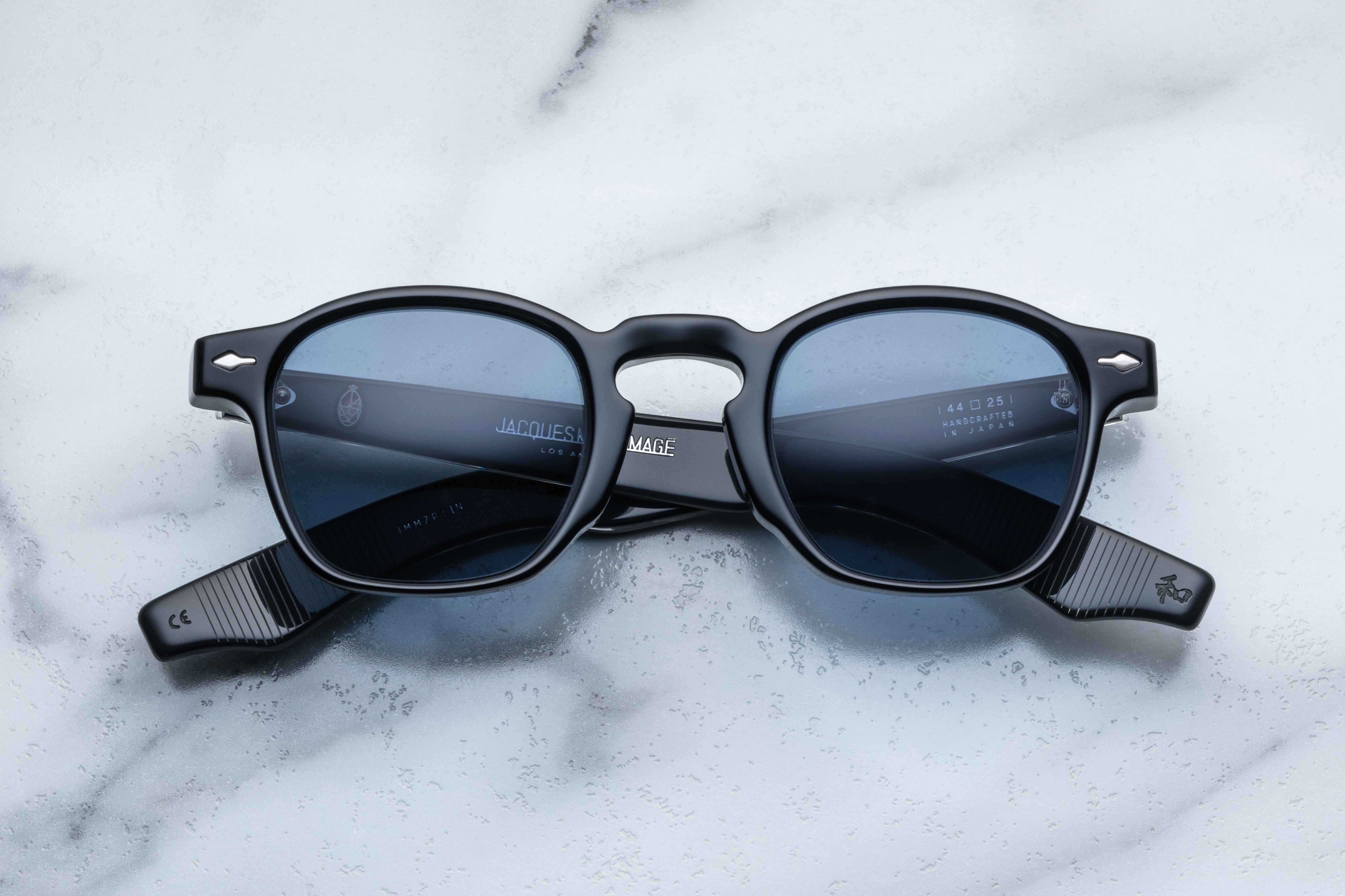 Jacques Marie Mage Zephirin sunglasses in Charbon with round frames and dark tinted lenses, front view image.