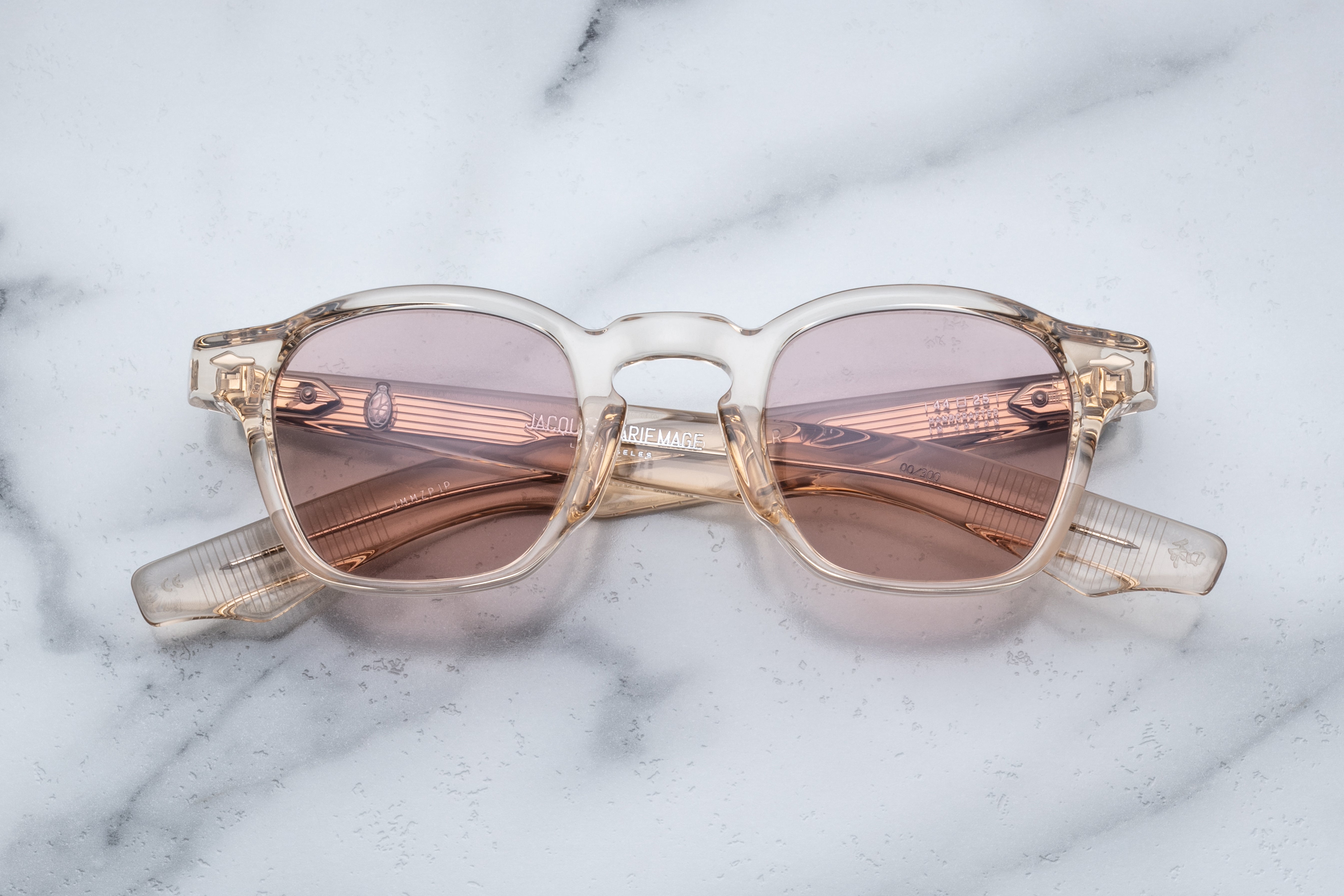 Jacques Marie Mage Zephirin sunglasses with pearl-colored frames and clear lenses, front view showing stylish design.