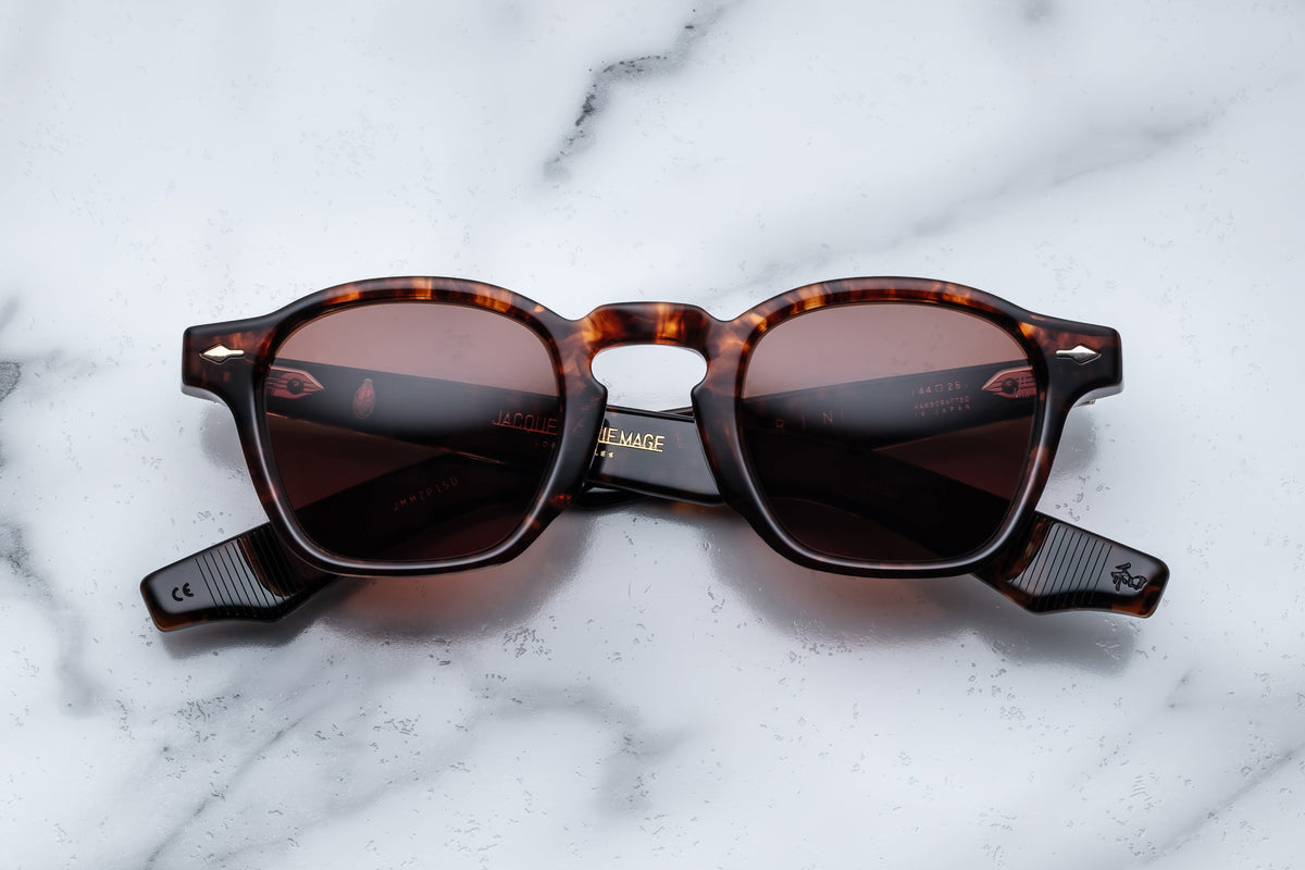 Jacques Marie Mage Zephirin Samoa sunglasses with rounded frames and dark tinted lenses, front view showing stylish design.