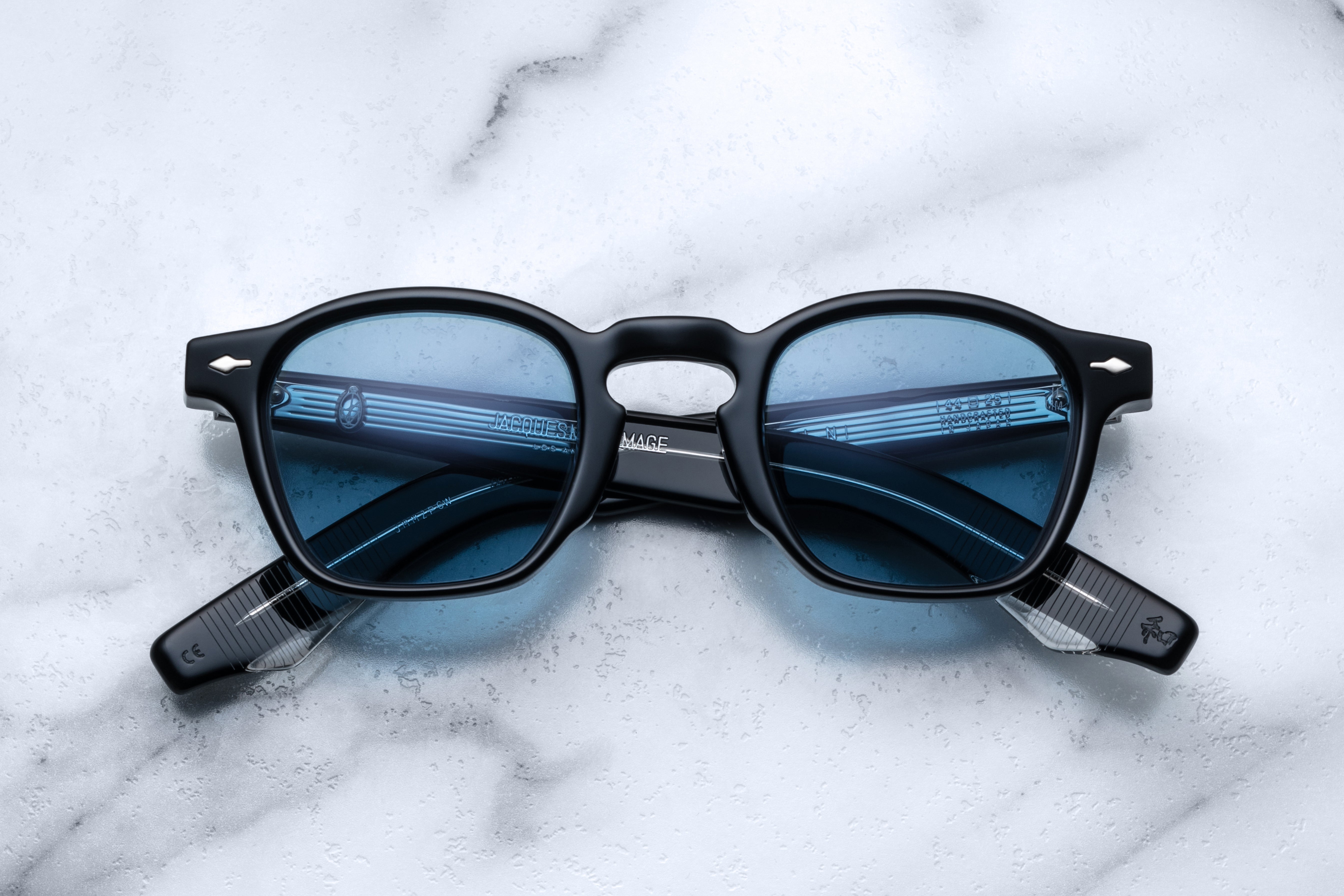 Jacques Marie Mage Zephirin titanium sunglasses with sleek frame and dark tinted lenses, front view.