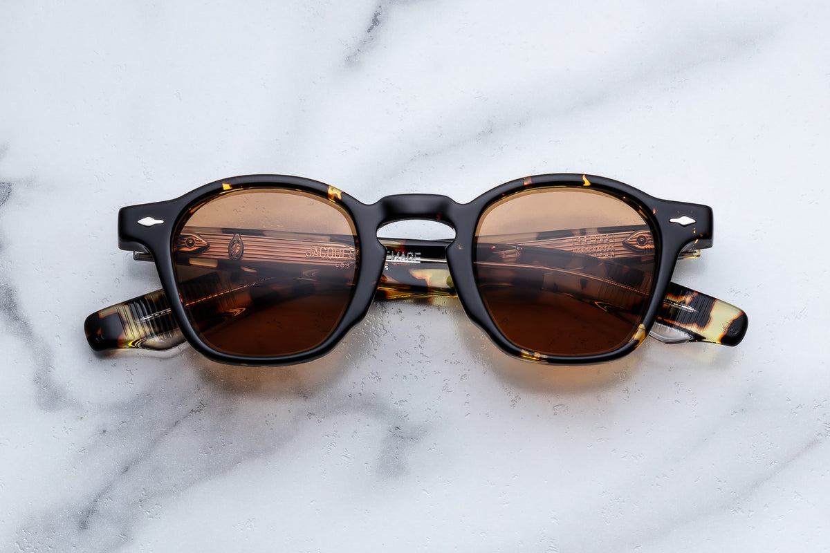 Jacques Marie Mage Zephirin sunglasses with round frames and dark lenses, stylish eyewear on a clean background