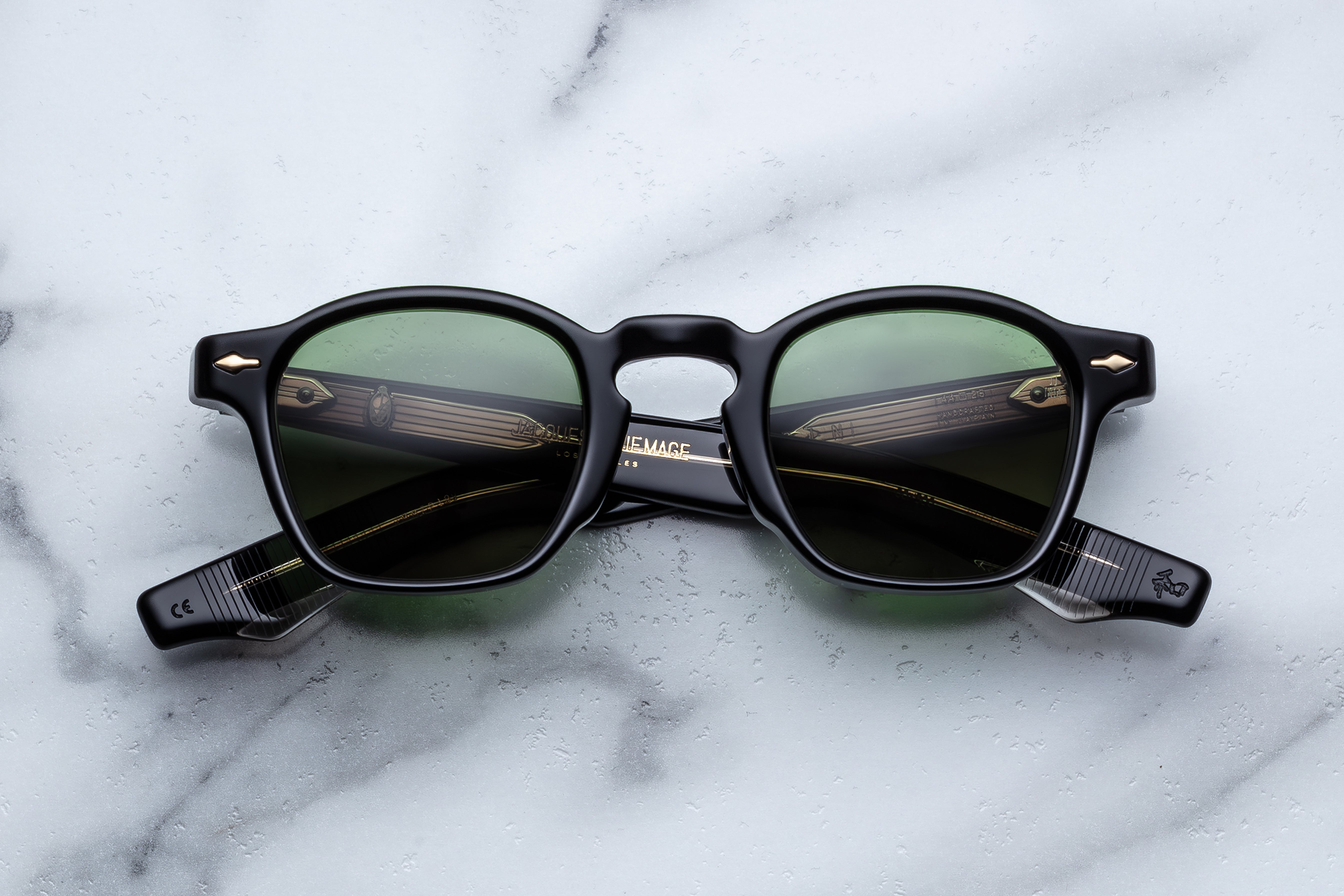 Jacques Marie Mage Zephirin Venom sunglasses with bold black frames and tinted lenses, front view.
