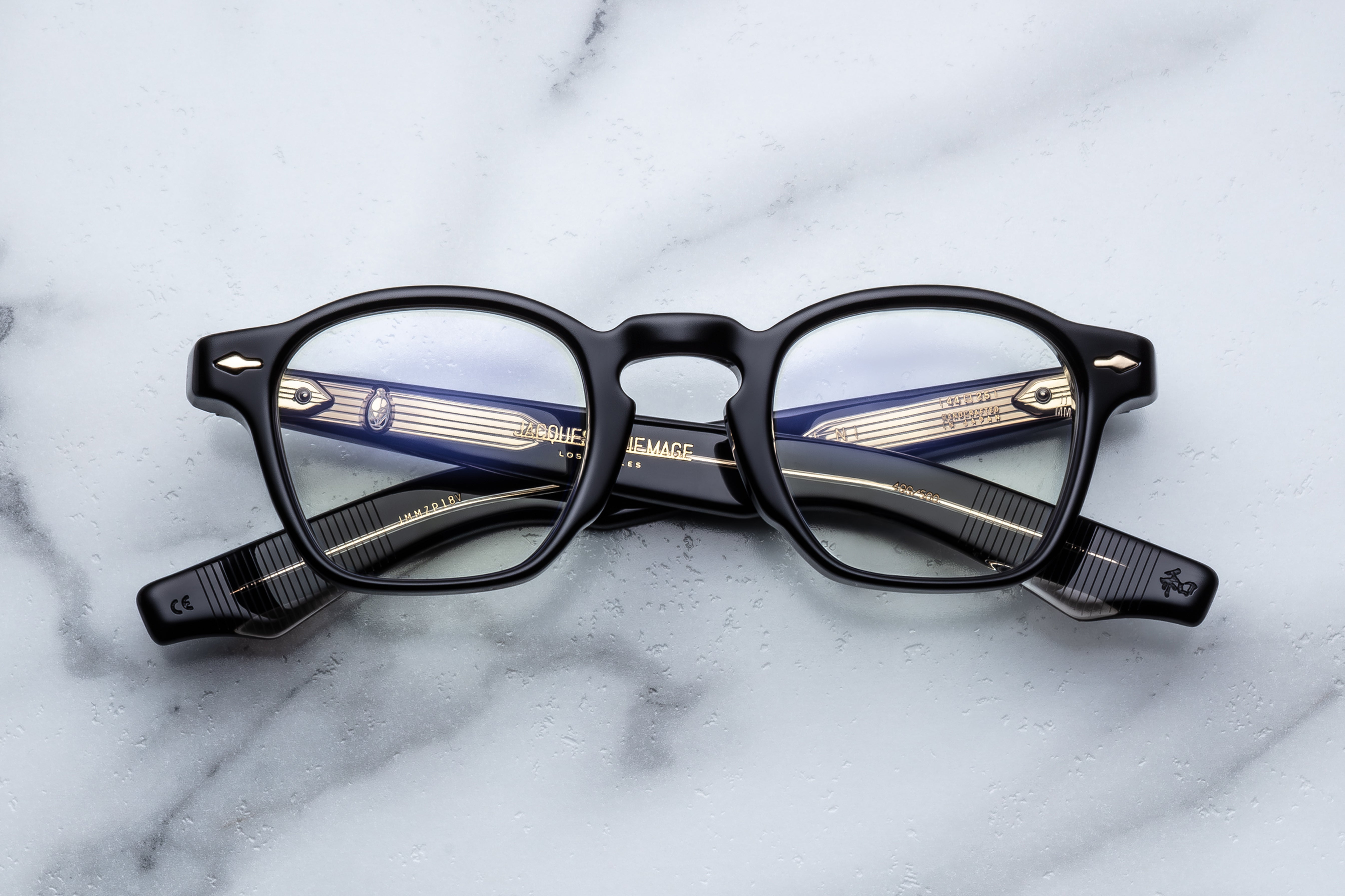 Jacques Marie Mage Zephirin Venom RX optical glasses with clear lenses and sleek black frames, front view.