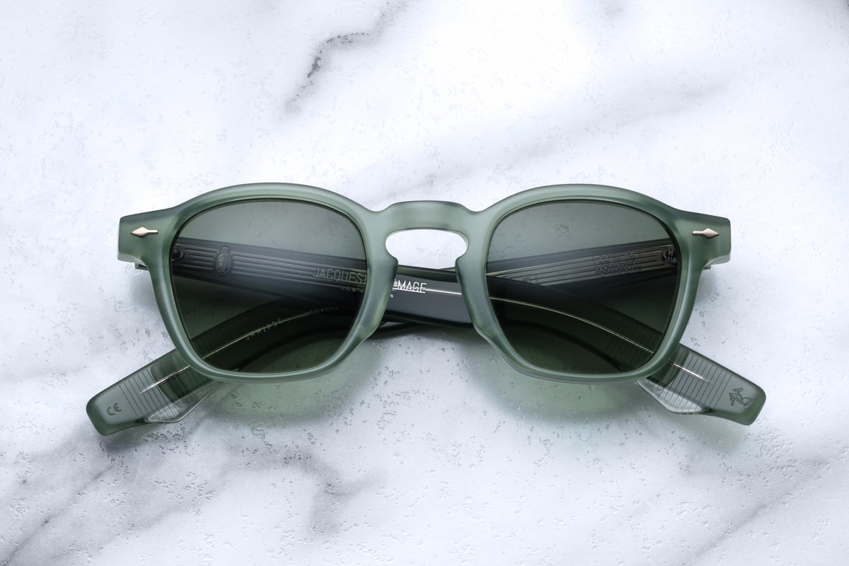 Jacques Marie Mage Zephirin sunglasses in green with round frames, front view showcasing stylish design and tinted lenses.