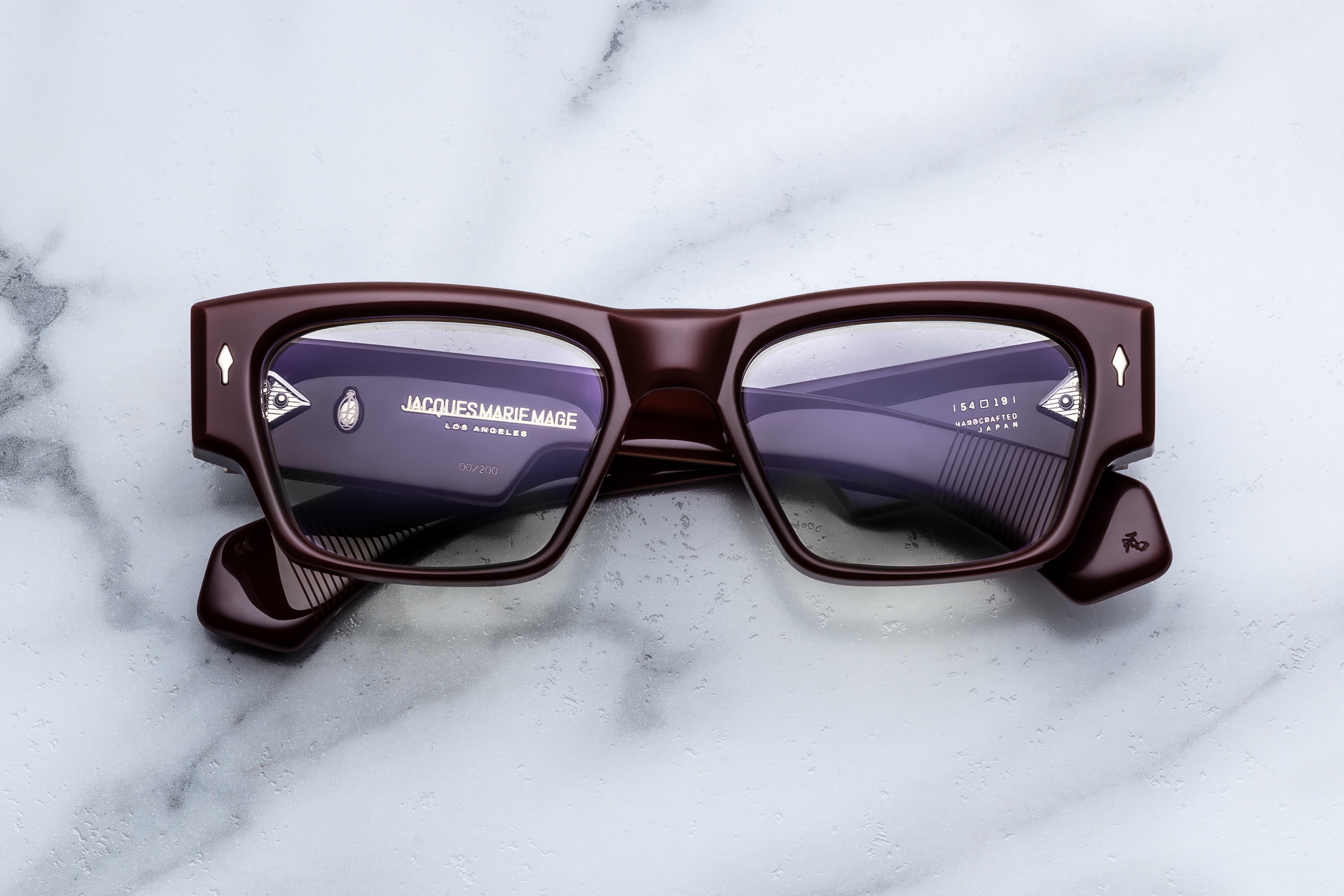 Jacques Marie Mage Zimmerman RX optical glasses in Bordeaux color, front view showing sleek frames and clear lenses.
