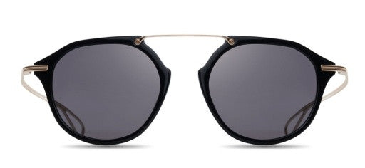 Close-up of DITA KOHN eyeglasses showing sleek black frames and detailed temple design.