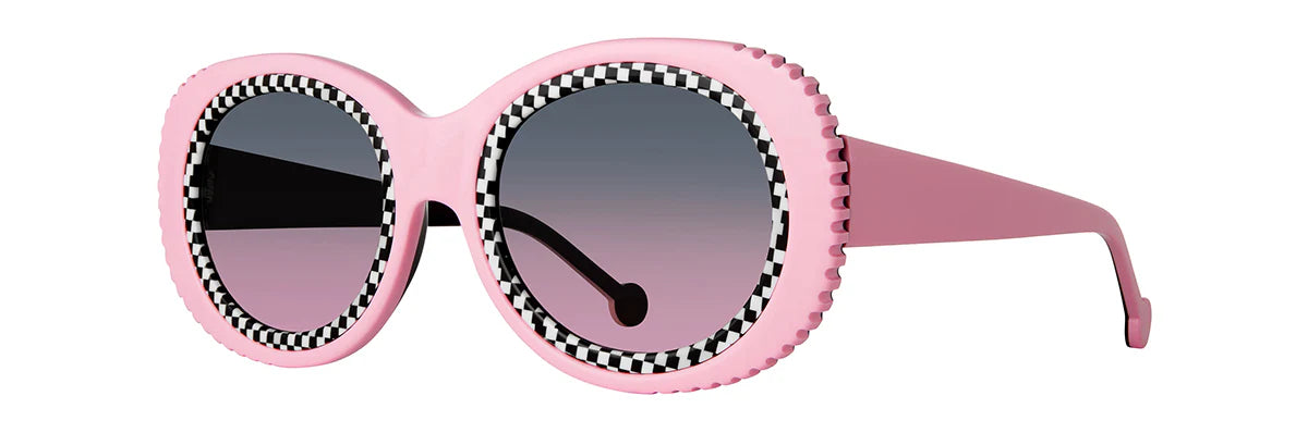 LA Eyeworks Saguaro sunglasses with grey-to-pink gradient lenses and bold black frame, shown on a white background.