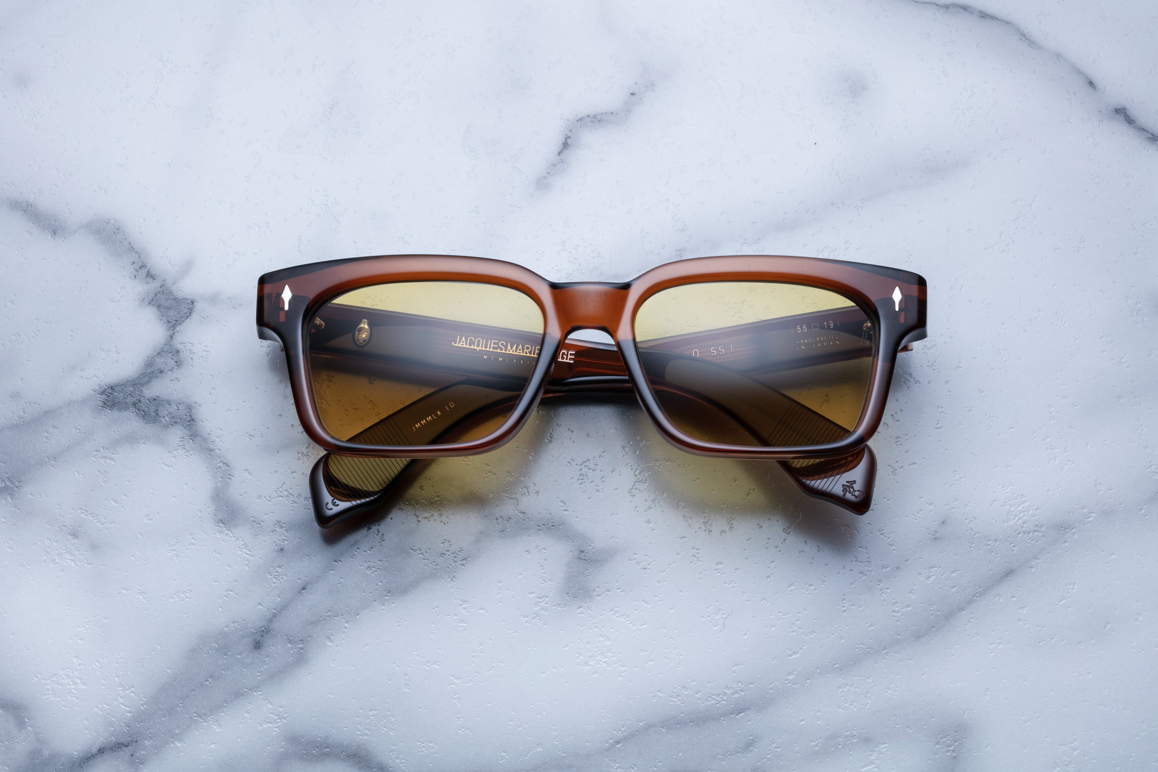 Jacques Marie Mage Molino 55 sunglasses with hickory-colored frames and clear lenses, front view showing stylish design.